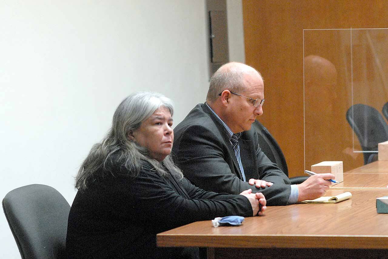 Larisa Jean Dietz of Sequim sits with attorney Stan Myers in July at Clallam County Superior Court in Port Angeles. (Keith Thorpe/Peninsula Daily News)