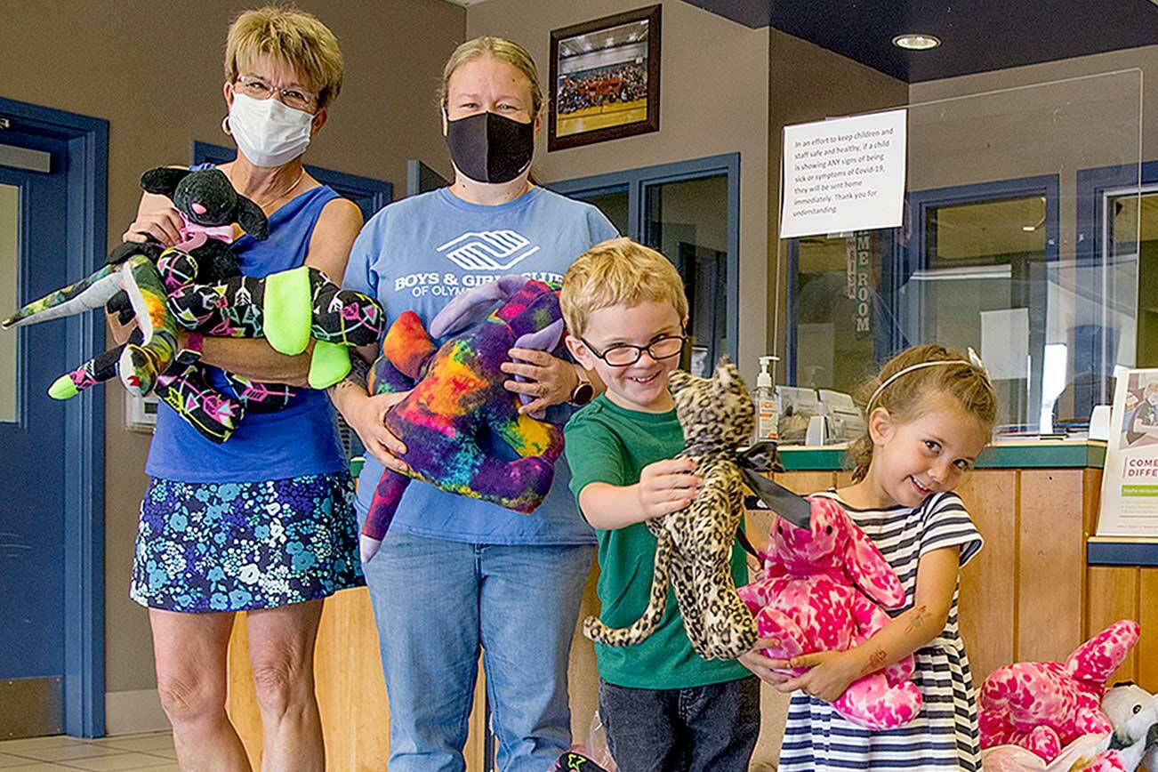 Holding animals sewn by Sequim’s Fiber Arts Neighborhood Group are, from left, Monica Dixon of the Sequim group, which is part of the American Sewing Guild; Tessa Jackson, director of the Sequim unit of the Boys & Girls Clubs of the Olympic Peninsula; Nick, 5; and Josie, 4; of Great Futures Preschool, housed at the Sequim unit. (Emily Matthiessen/Olympic Peninsula News Group)