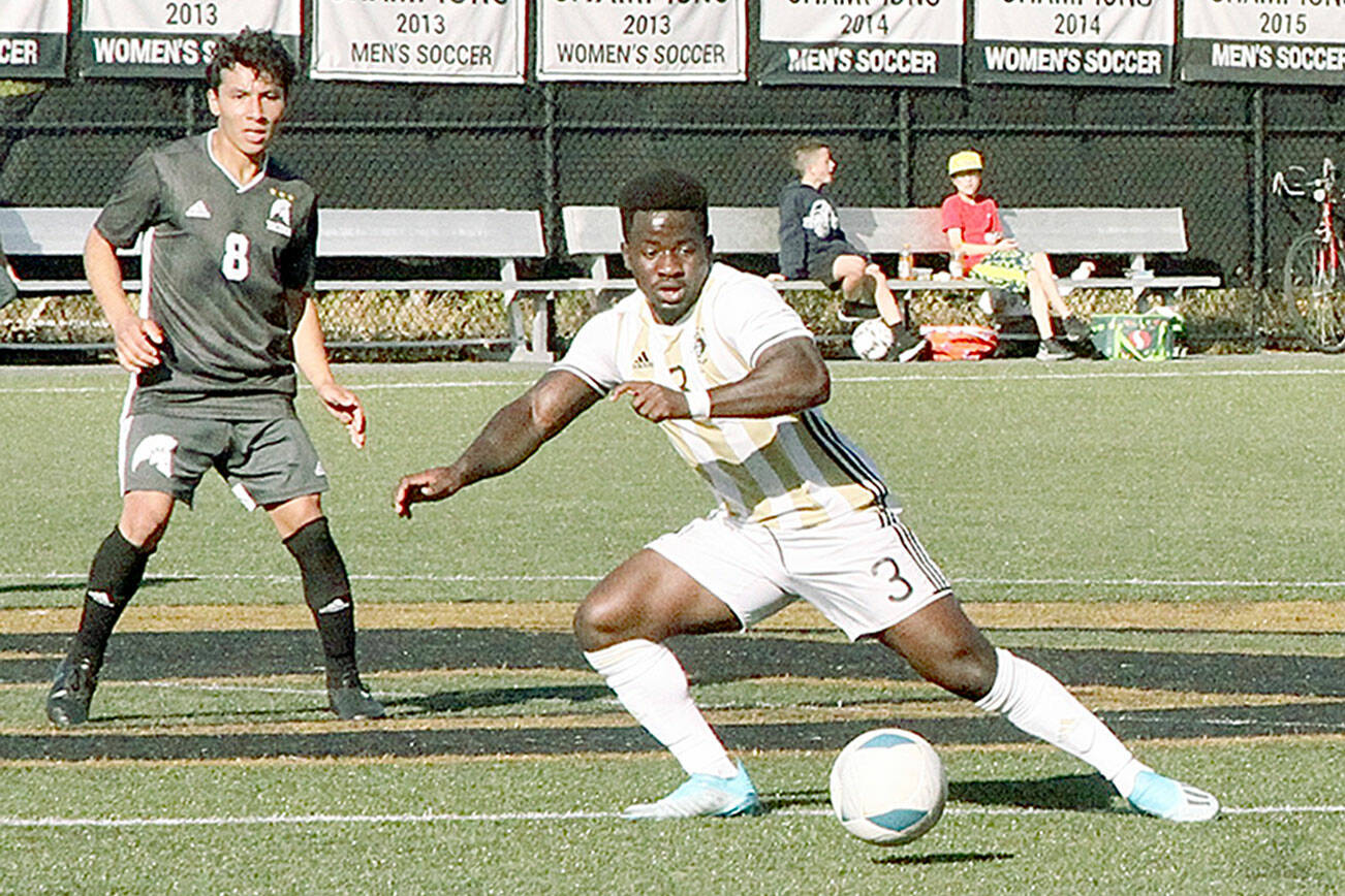 Peninsula College's Theodore Baiye, left, and Nicolas Hernandez work the ball upfield during the Pirates' 2-0 win over the Titans on Wednesday at Wally Sigmar Field. (Dave Logan/for Peninsula Daily News)