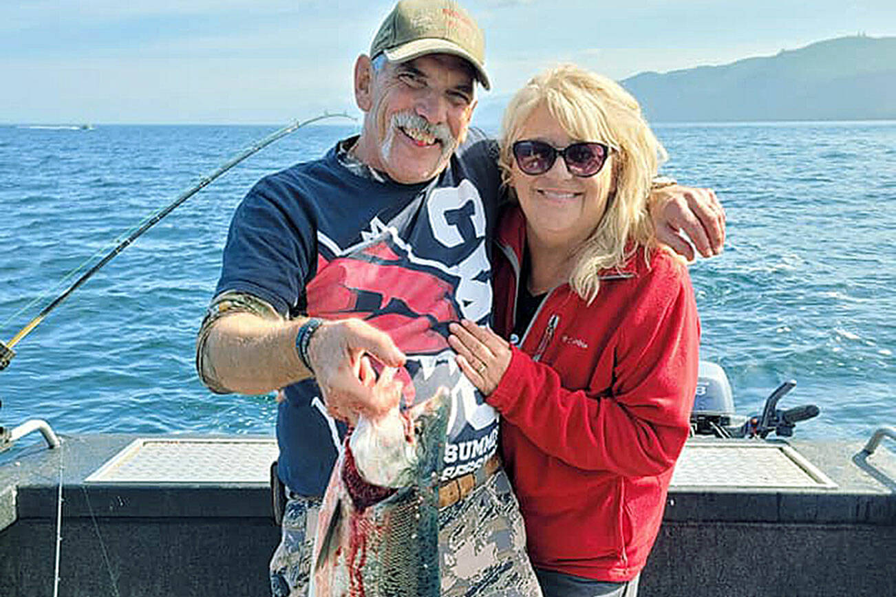 Terry and Barbara Rossow of Ellensburg caught this good-sized coho while fishing off Sekiu on Wednes-day. The pair also enjoyed whale watching after the big catch.