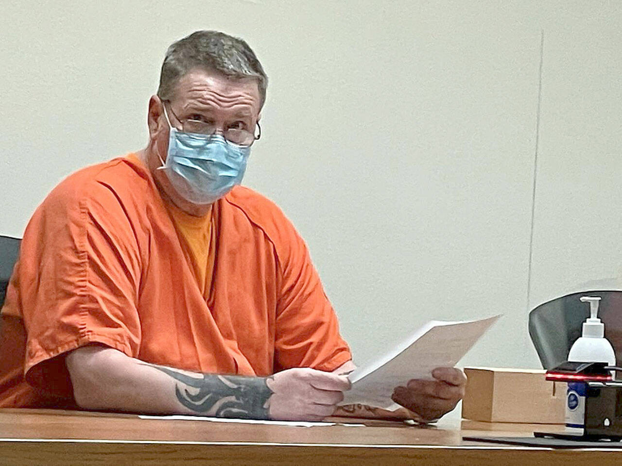 Dennis Bauer, charged with three counts of aggravated first-degree murder, is pictured at an Aug. 17 Clallam County Superior Court hearing. (Paul Gottlieb/Peninsula Daily News)