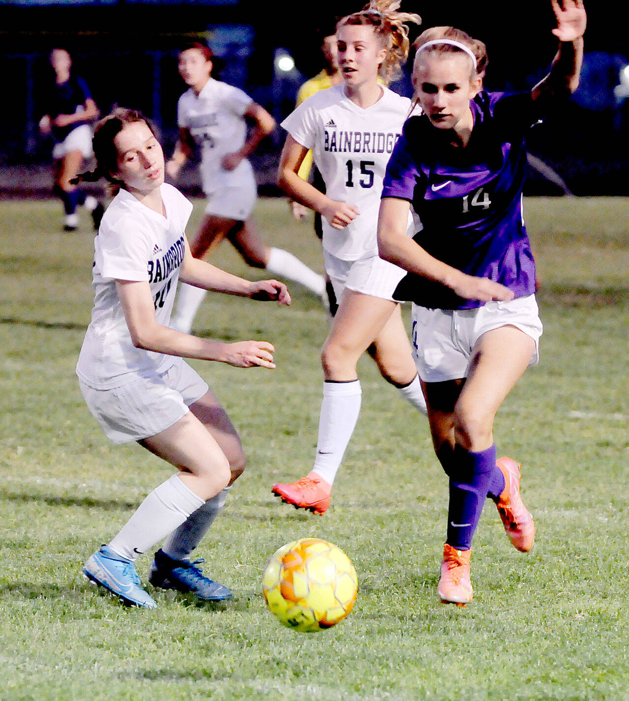 Sequim’s Hannah Wagner, right, advances the ball up field during match with Bainbridge on Tuesday. Wagner scored a goal in the Wolves’ 1-1 (4-1) penalty kick shootout loss to the Spartans. (Michael Dashiell/Olympic Peninsula News Group)