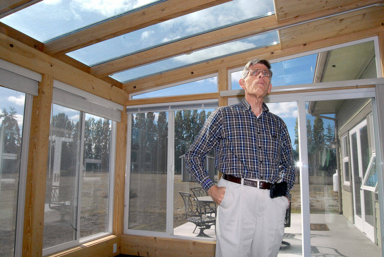 A sunroom with triple-pane windows and heat-absorbing tiles provides a large portion of the heat in David Large’s rural Sequim home, pictured here in 2018. Large’s home is on the American Solar Energy Society’s annual open house tour on Saturday. (File photo by Keith Thorpe/Olympic Peninsula News Group)