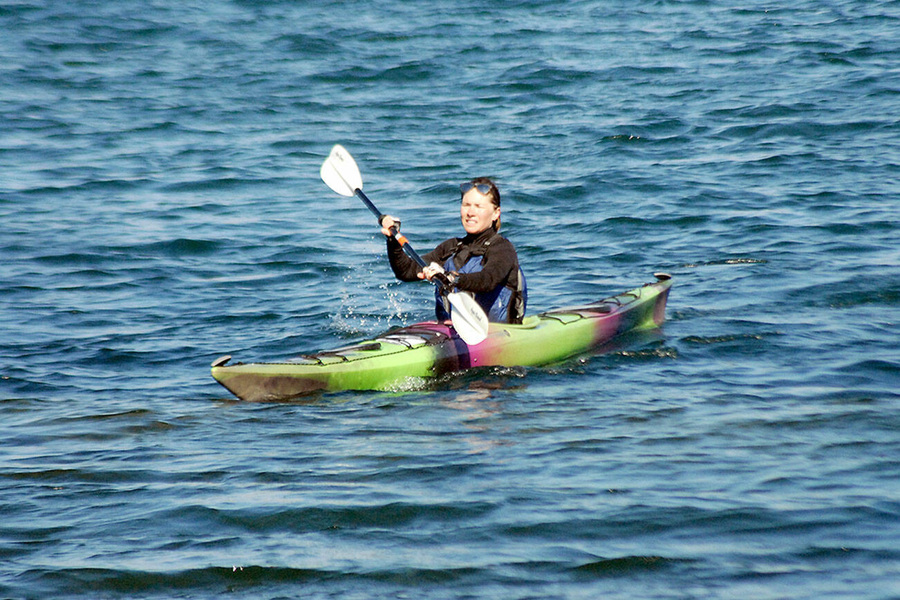 Heidi Hietpas of Sequim completes the kayaking leg of Saturday's Big Hurt as part of a tandem team with her husband, Forest Hietpas. (Keith Thorpe/Peninsula Daily News)