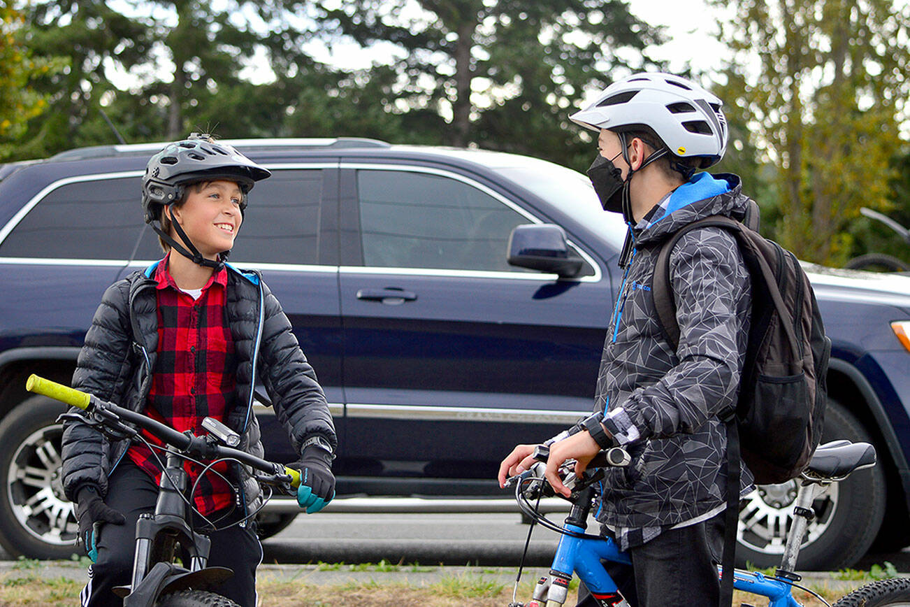 Django Lynge, 13, and Dustin Hines, 14, stand ready for Wednesday’s ReCyclery Mountain Bike Club ride around Port Townsend. (Diane Urbani de la Paz/Peninsula Daily News)