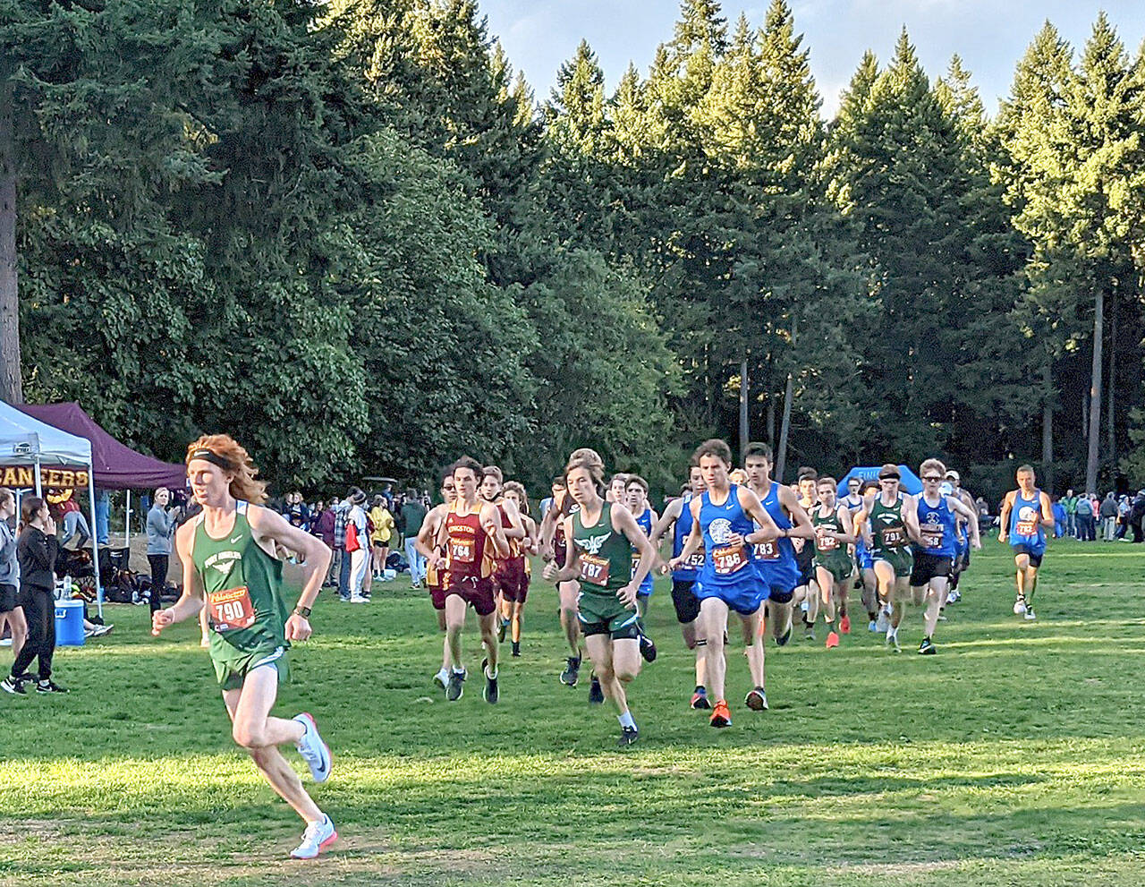 Rodger Johnson photo Port Angeles’ Jack Gladfelter, far left, leads the pack at an Olympic League 2A cross-country meet in Bremerton on Wednesday. Gladfelter won the boys’ race while Sequim’s Riley Pyeatt won the girls’ race.