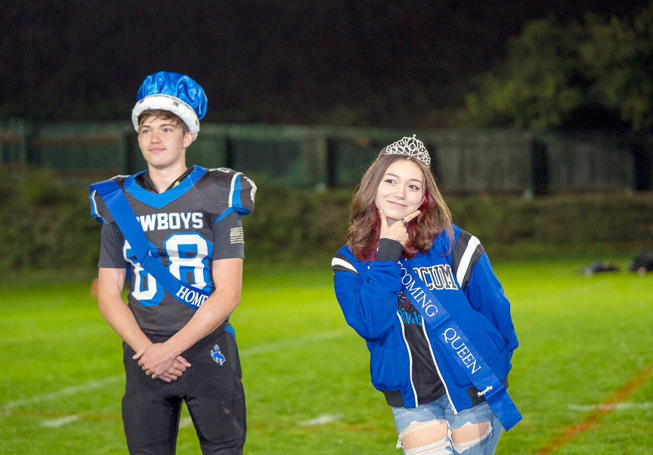 Mikiya Shiflett, left, the Chimacum High School homecoming king, and Hannah Cotterill, queen, are presented Friday during halftime of the East Jefferson football game against Cascade Christian at Memorial Field in Port Townsend. The Port Townsend king and queen, Jerome Reaux Jr. and Faye Berry, also were honored during halftime. Chimacum and Port Townsend have combined sports programs and are competing together as the East Jefferson Rivals. (Steve Mullensky/for Peninsula Daily News)