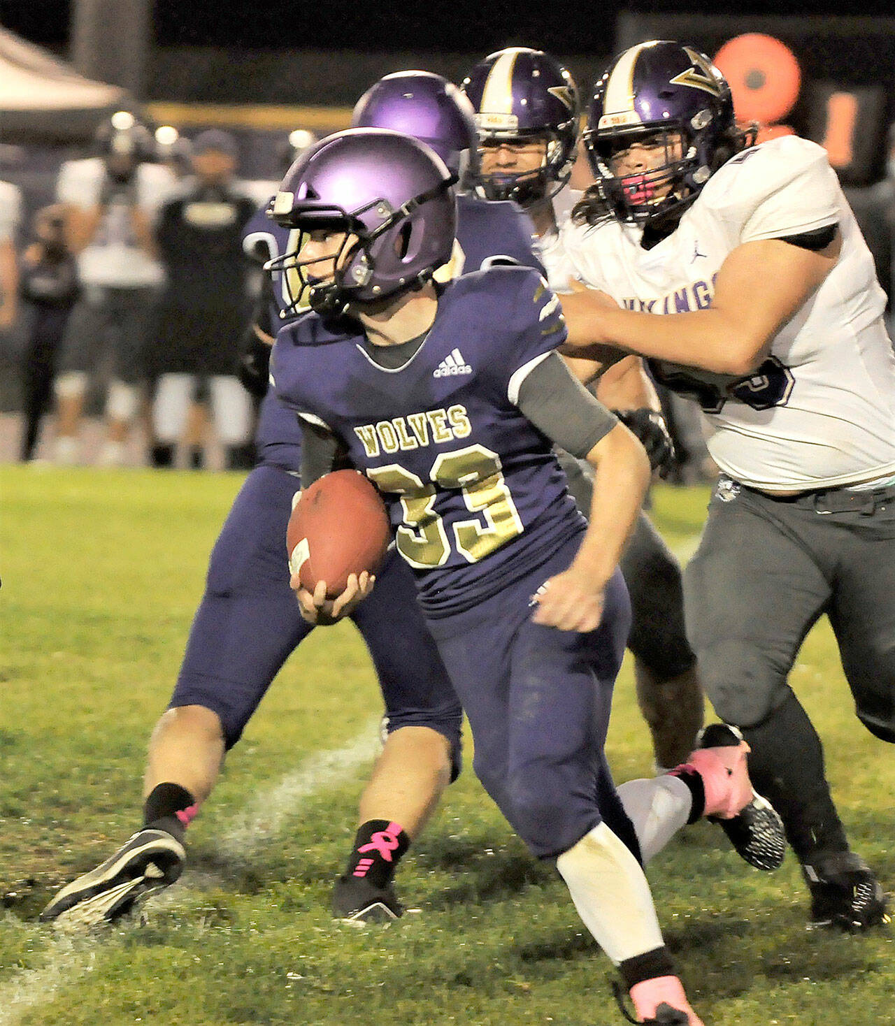 Sequim running back Sam Fitzgerald looks for running room in the Wolves’ 49-7 loss to North Kitsap on Oct. 8. Fitzgerald led Sequim with 88 rushing yards. Sequim Gazette photo by Michael Dashiell