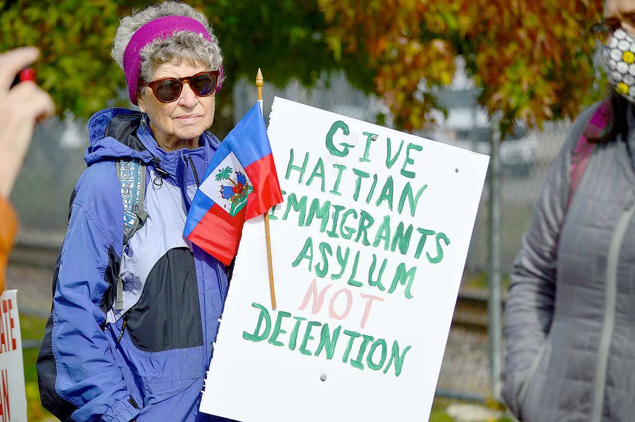 Diane Bommer of the Jefferson County Immigrants’ Rights Advocates traveled with a group of North Olympic Peninsula activists Sunday to demonstrate in support of Haitian asylum seekers held at the Tacoma Northwest Detention Center. (Diane Urbani de la Paz/Peninsula Daily News)
