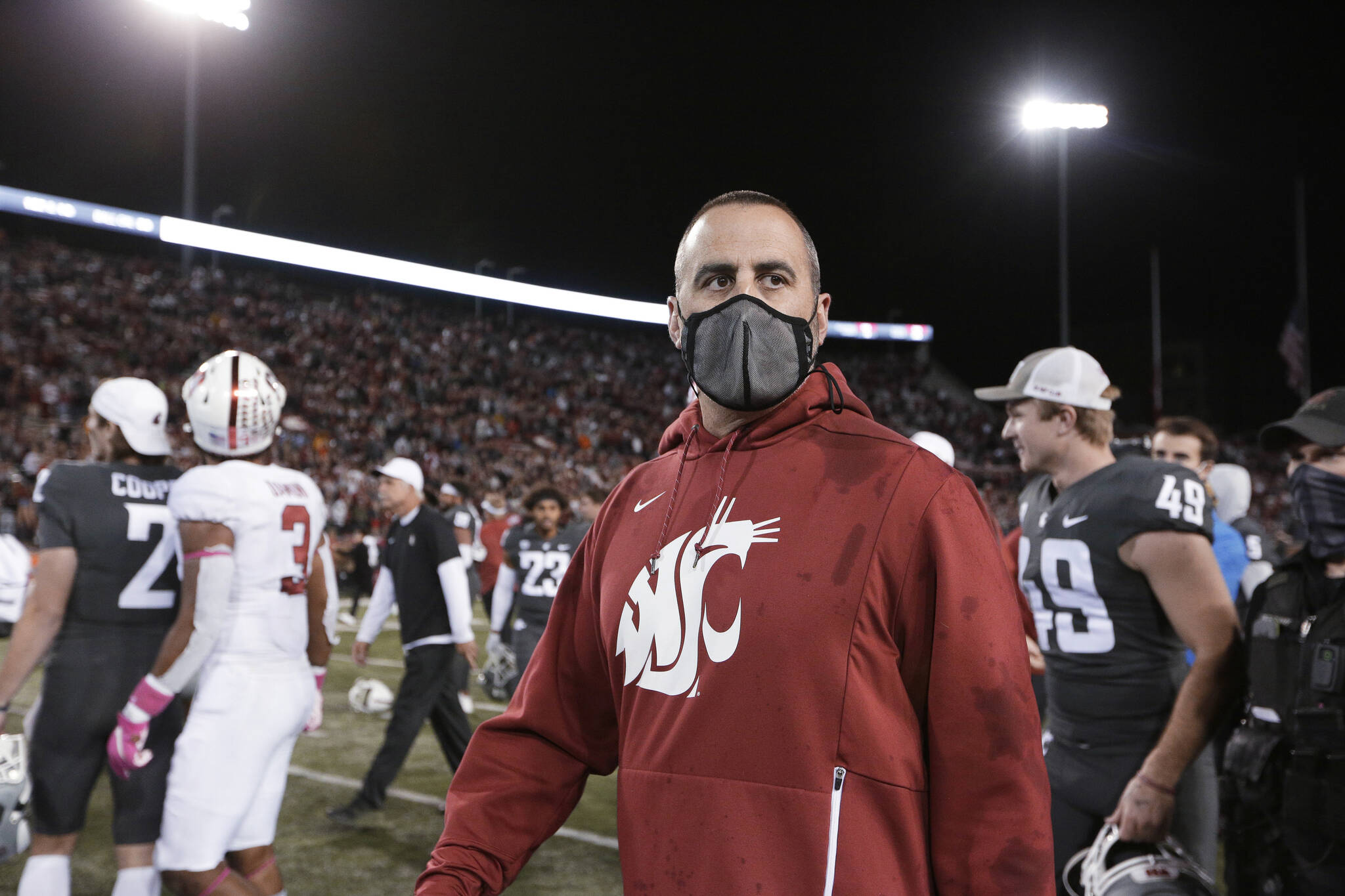Washington State coach Nick Rolovich walks on the field after the team’s NCAA college football game against Stanford, Saturday, Oct. 16, 2021, in Pullman, Wash. Washington State won 34-31. (AP Photo/Young Kwak)