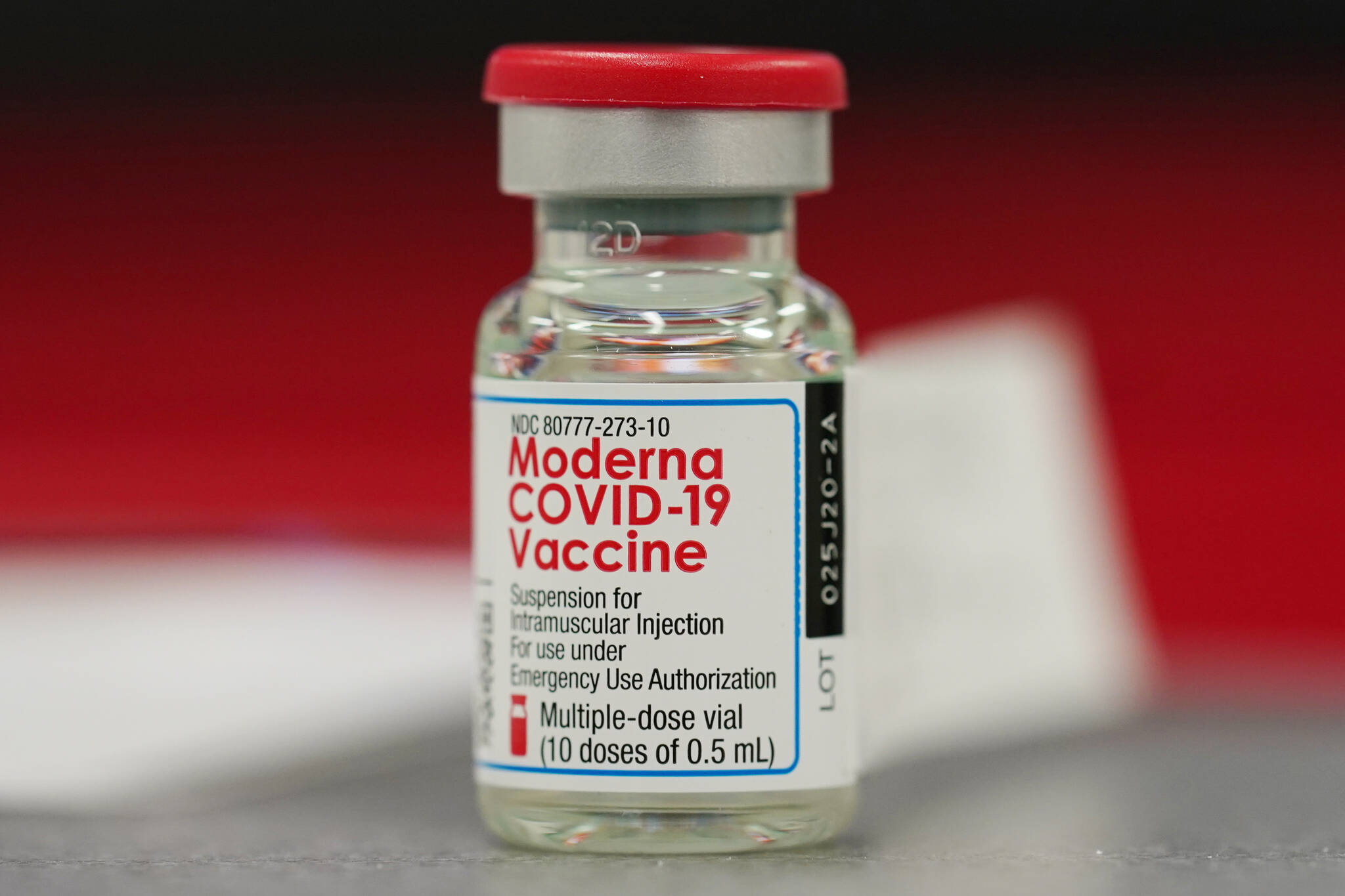 FILE - This Dec. 23, 2020 file photo shows a vial of the Moderna COVID-19 vaccine in the first round of staff vaccinations at a hospital in Denver. Federal regulators are expected to authorize the mixing and matching of COVID-19 booster shots this week in an effort to provide flexibility for those seeking to maintain protection against the coronavirus. The upcoming announcement by the Food and Drug Administration is likely to come along with authorization for boosters of the Moderna and Johnson & Johnson shots.  (AP Photo/David Zalubowski, File)