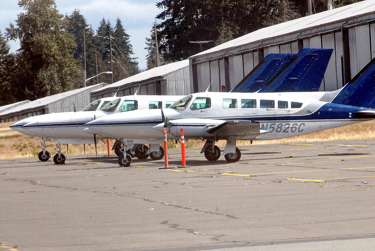 Three Dash Air Shuttle Cessna 403C aircraft sit parked at William R Fairchild International Airport on Aug. 31 as they await entering into scheduled service between Port Angeles and SeaTac Airport. (Keith Thorpe/Peninsula Daily News)