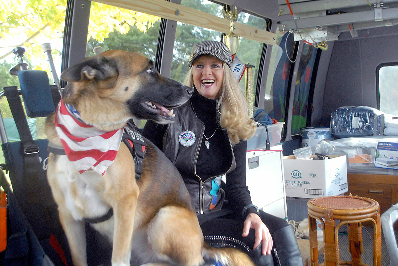 Captain-Crystal Stout and therapy dog â€‹â€‹Lucee-Light (Keith Thorpe / Peninsula Daily News)