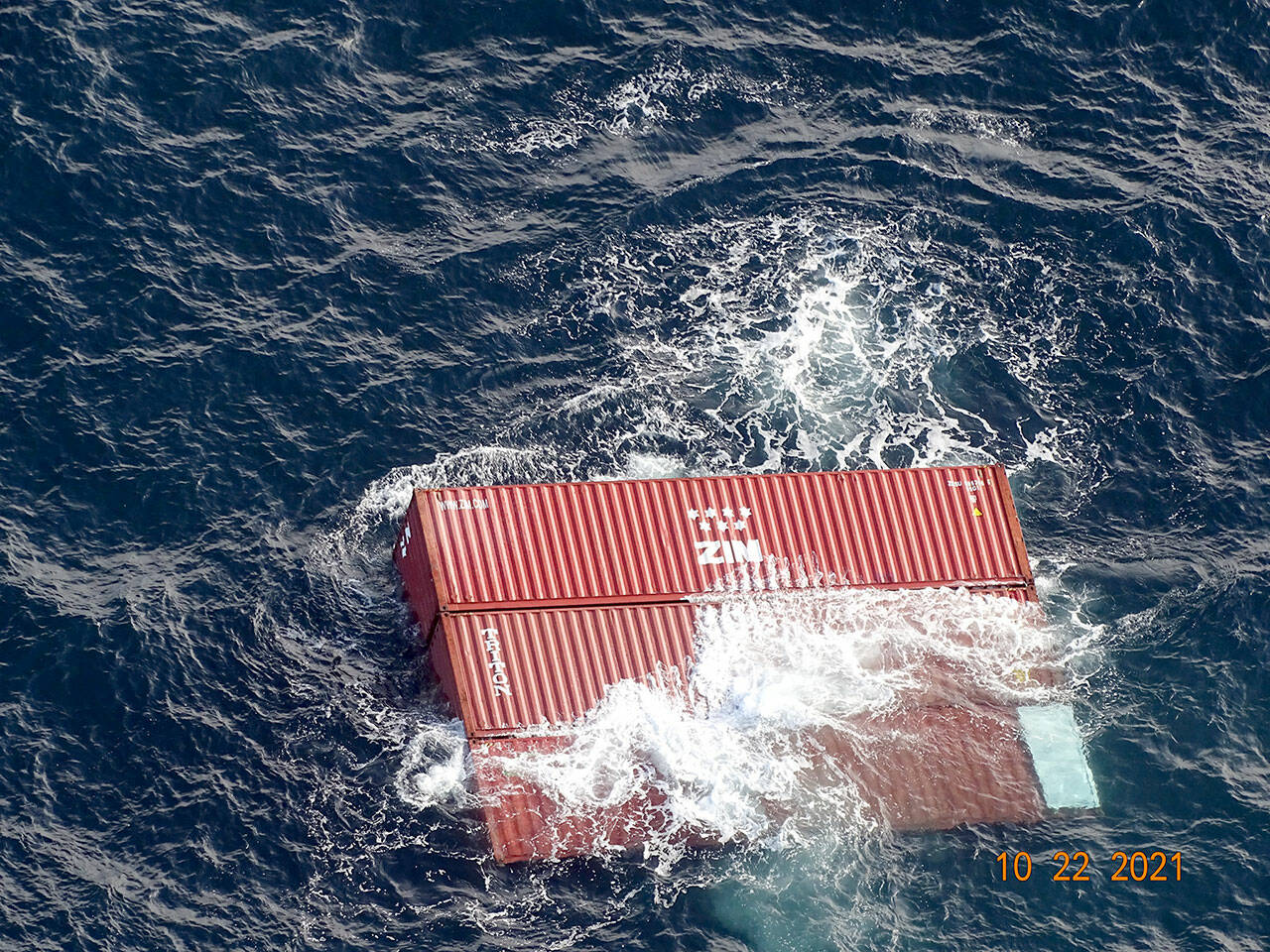 A group of three linked shipping containers from the MV Zim Kingston were photographed when they were spotted by a Port Angeles helicopter crew on Friday. (U.S. Coast Guard)