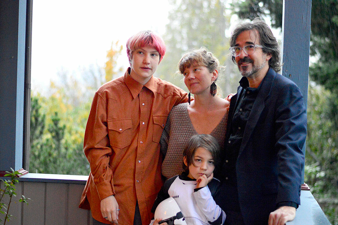 Michael D’Alessandro, right, is the new executive director of Olympic Angels. With him on his porch in Port Townsend are his partner George Marie, center, daughter Sophia James, 17, left, and son Emile, 6, in his “Star Wars” stormtrooper costume. Not pictured is son Henri, 15. (Diane Urbani de la Paz/Peninsula Daily News)