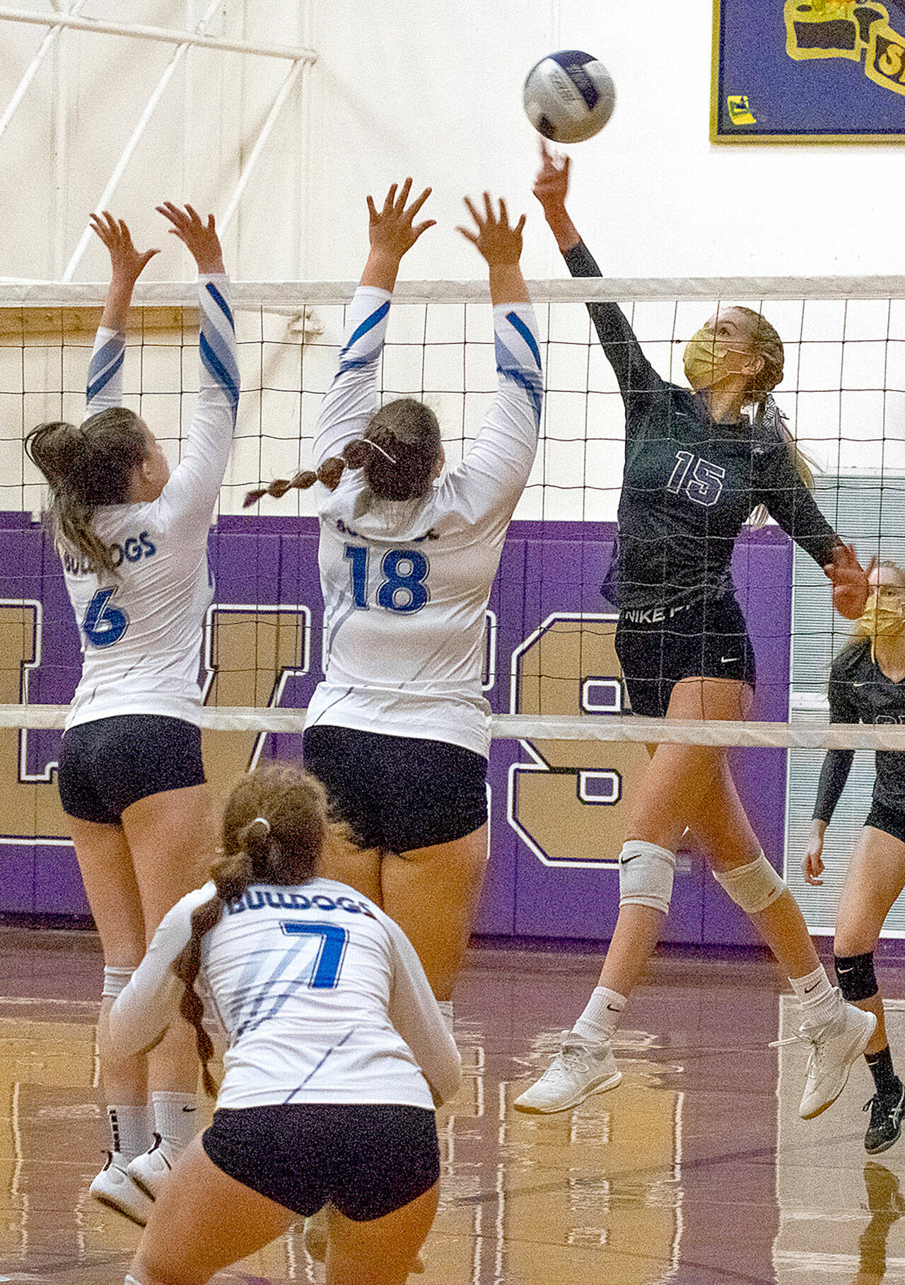 Sequim’s Kendall Hastings (15) tips a shot past North Mason defenders in the Wolves’ 3-1 Olympic League win Tuesday night. (Emily Matthiessen/Olympic Peninsula News Group)