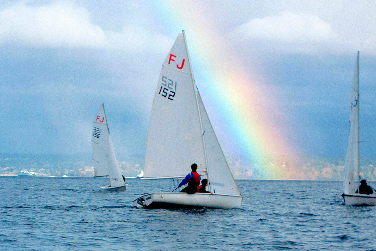 Port Angeles High School sailing team members Elliot Dahlin and Fern Knobel (152), sail at a regional scrimmage this weekend off Kingston as a rainbow comes out. Teammates Ozzy Minard and Ella Schulz are in boat 156. (Photo courtesy of Perry Brestel)