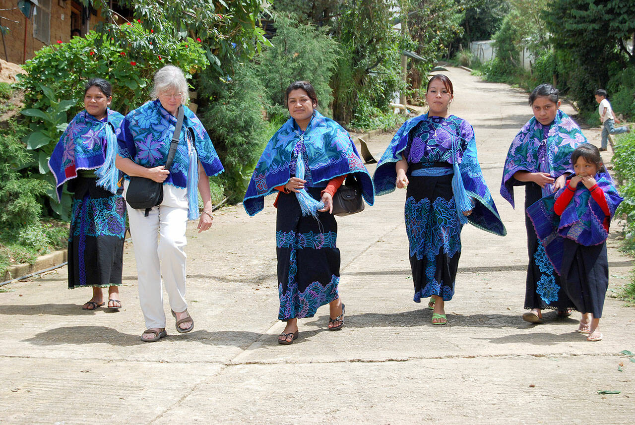 Judith Pasco, second from left, takes a walk with women in Zinacantán, Mexico, in July 2008, two years after cofounding the Mujeres de Maiz Opportunity Foundation. (Diane Urbani de la Paz/Peninsula Daily News)