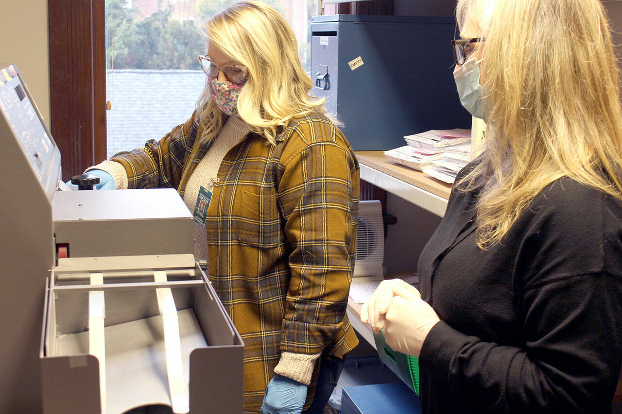 Jefferson County Elections Coordinator Quinn Grewell, left, and Chief Deputy Auditor Brenda Huntingford tabulate ballots Wednesday afternoon in the Auditor’s Office for the second round of ballot counts released late in the afternoon. (Zach Jablonski/Peninsula Daily News)