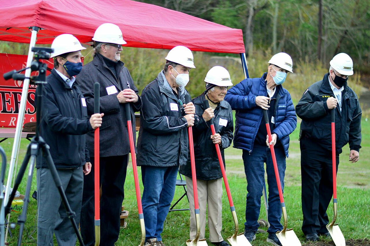 From left, project manager Jim Nuerenberg, Marrowstone Island Foundation president Bud Ayres and past president Bruce Carlson, retired volunteer Pat Burns, fire commissioner Dave Johnson and East Jefferson Fire Rescue Chief Bret Black at Thursday’s groundbreaking for the Marrowstone Island fire station. (Diane Urbani de la Paz/Peninsula Daily News)