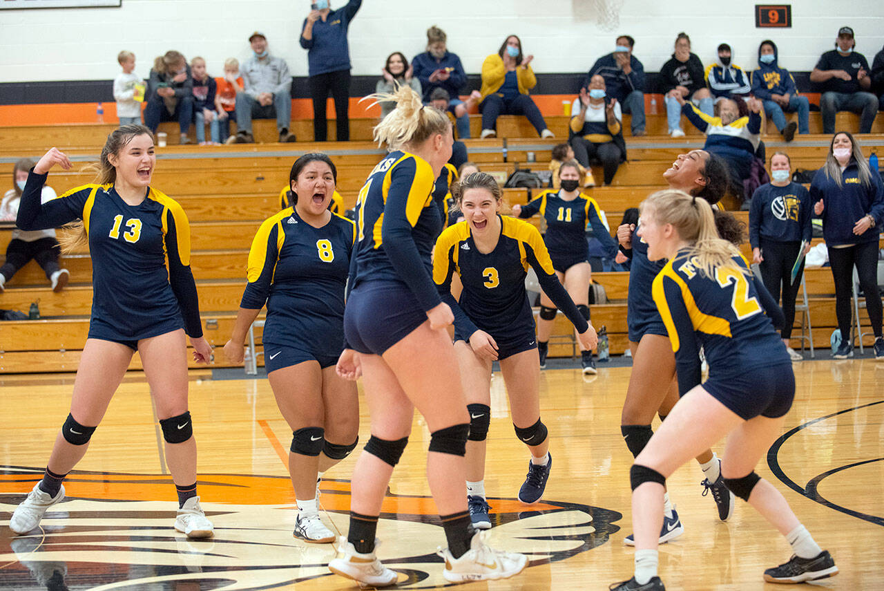 Forks celebrates after downing Onalaska in a loser-out district volleyball tournament game at Napavine High School. The Spartans fell 3-2 to Rainier in a winner-to-state, loser-out contest later Wednesday evening. (Courtesy Eric Trent/The Chronicle)