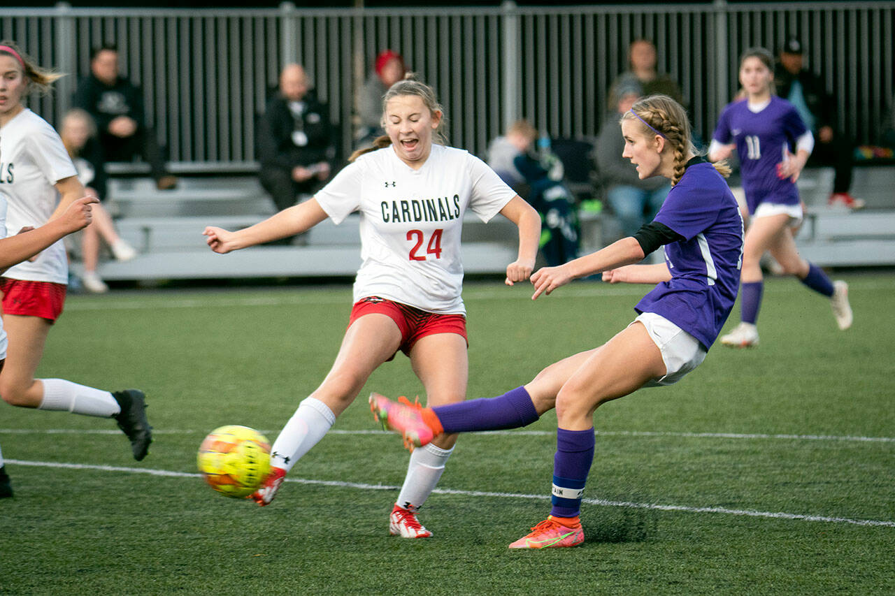 Jesse Major/for Peninsula Daily News Sequim’s Hannah Wagner boots a shot on goal during the Wolves 3-1 Bi-District Tournament victory over Orting on Thursday at Peninsula College’s Wally Sigmar Field.