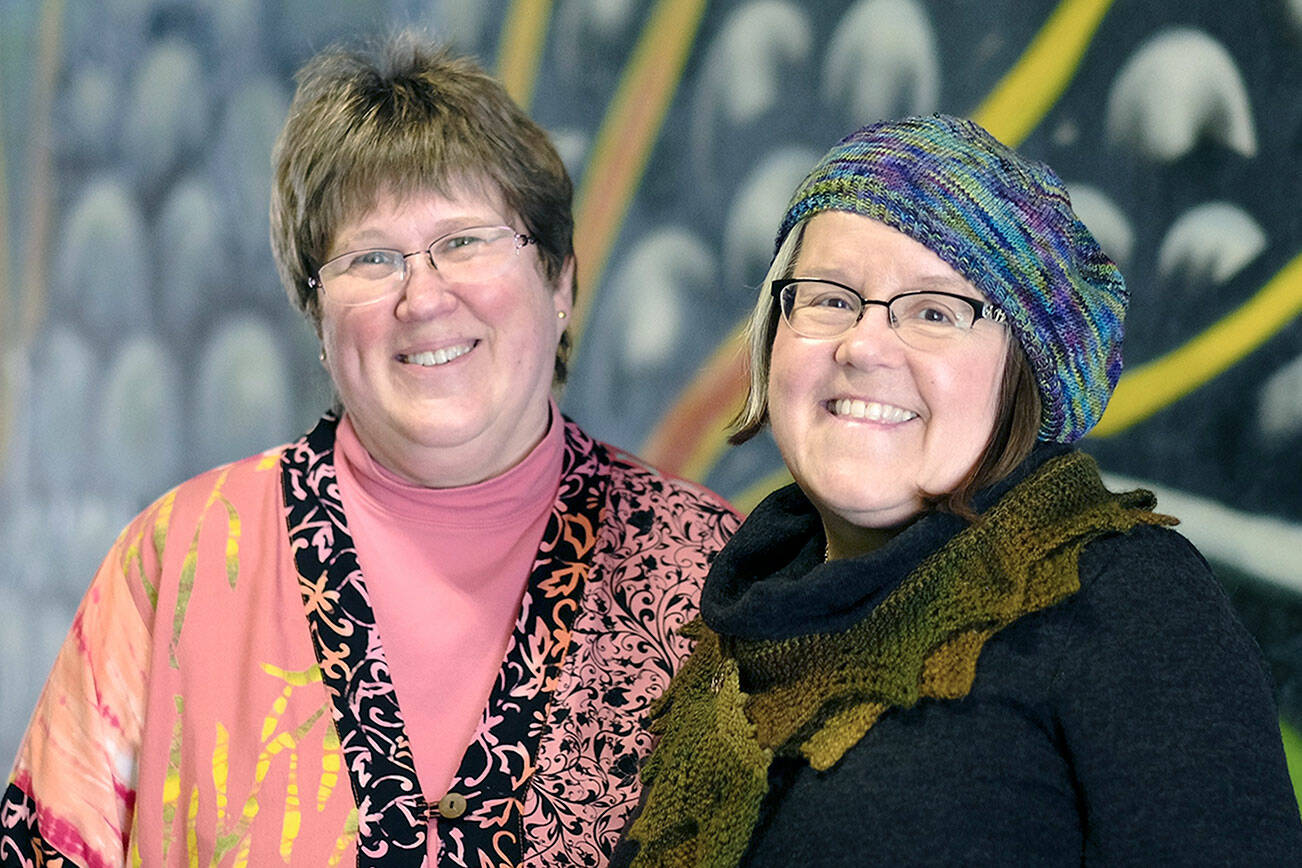 Beth Witters, on left, and MarySue French, co-owners of Cabled Fiber and Yarn, will celebrate 10 years in business on Saturday.