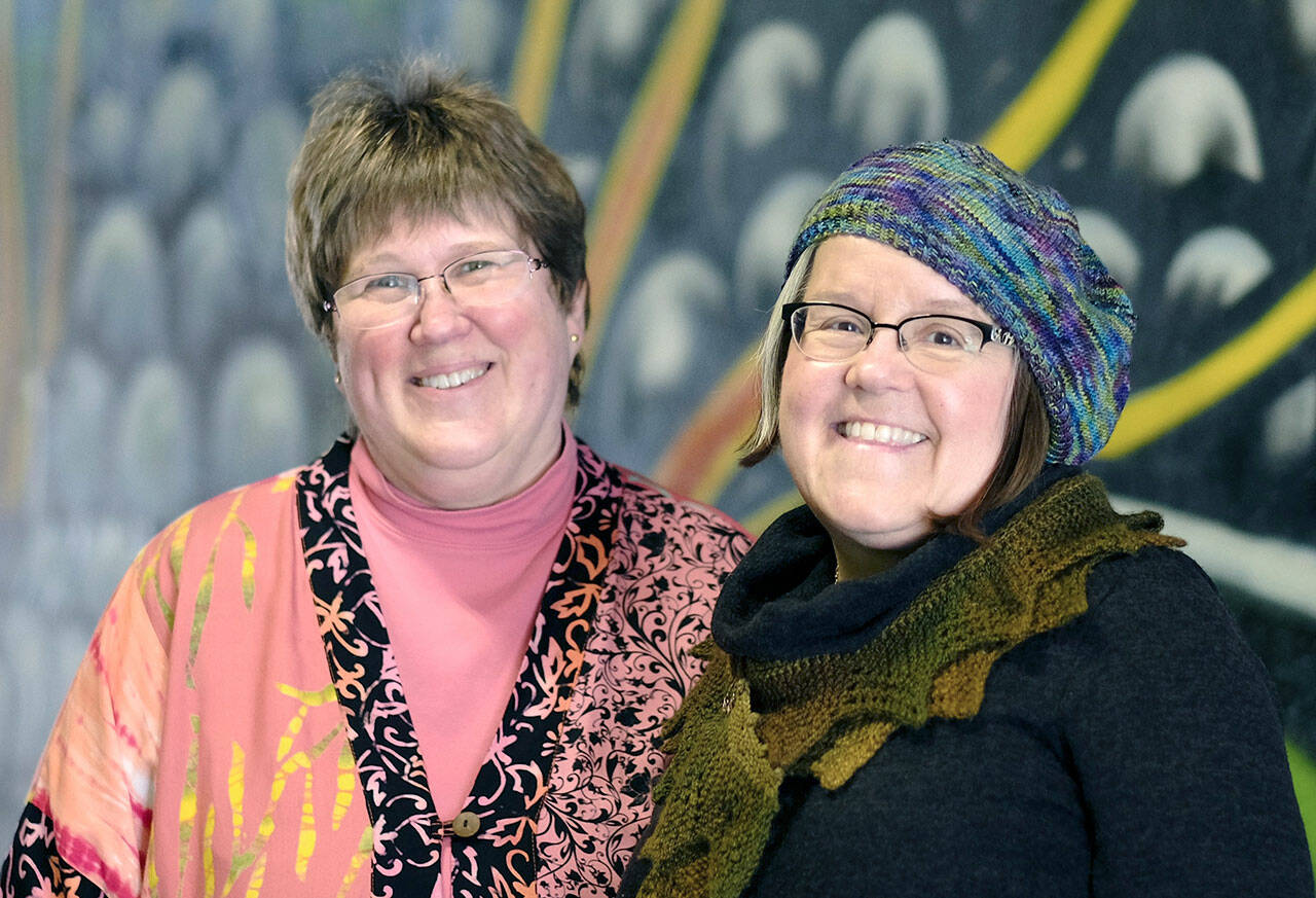 Beth Witters, left, and MarySue French, co-owners of Cabled Fiber and Yarn, will celebrate 10 years in business Saturday.