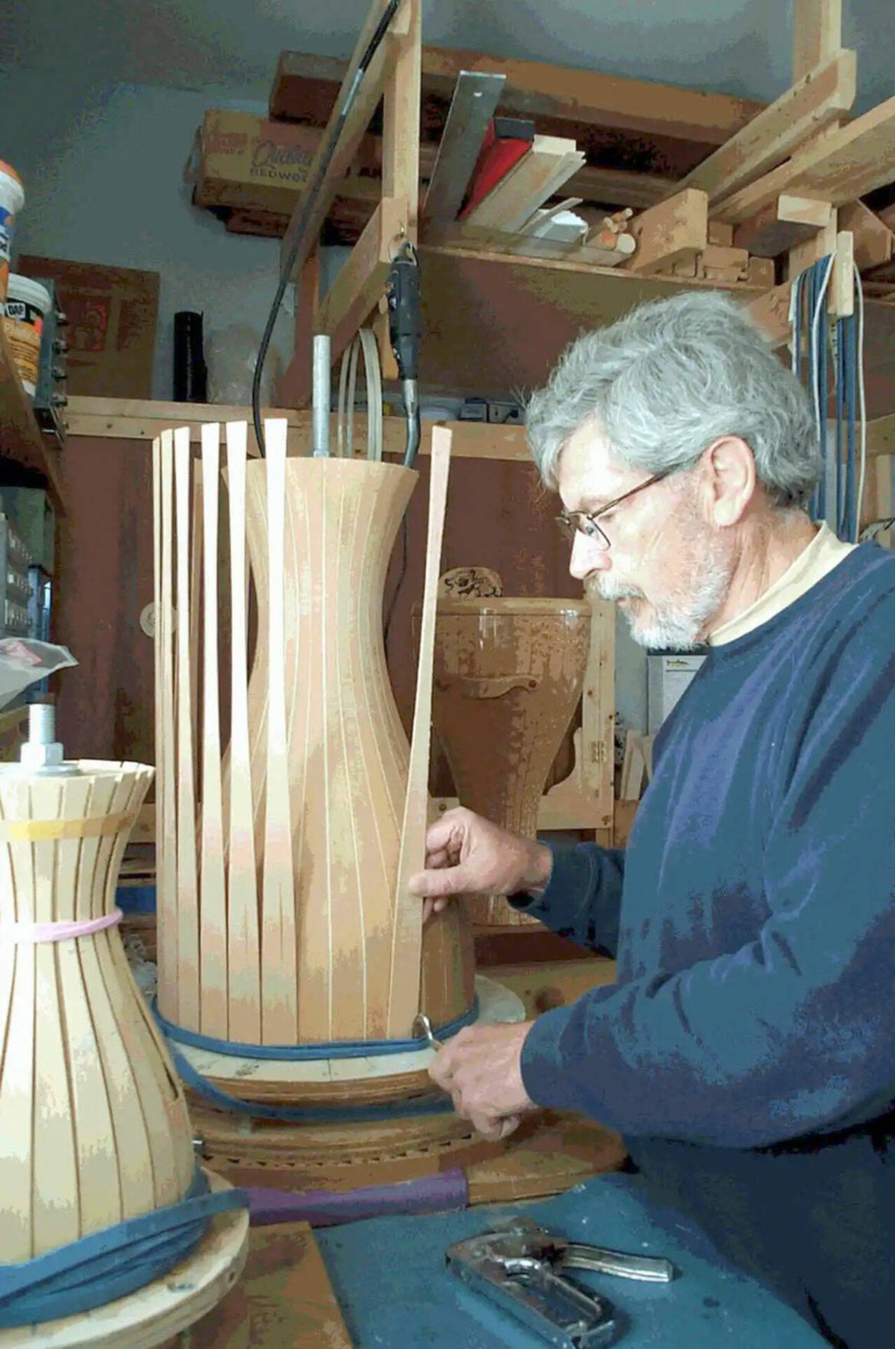 Tom Stewart works on a hand-made drum.
