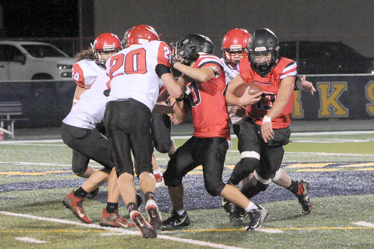 Neah Bay’s Julian Carrick looks for running room Friday night on the turf of Spartan Stadium in Forks during a 1B district playoff game with Mossyrock. Carrick had 319 yards rushing and Neah Bay won 50-40. (Lonnie Archibald/for Peninsula Daily News)