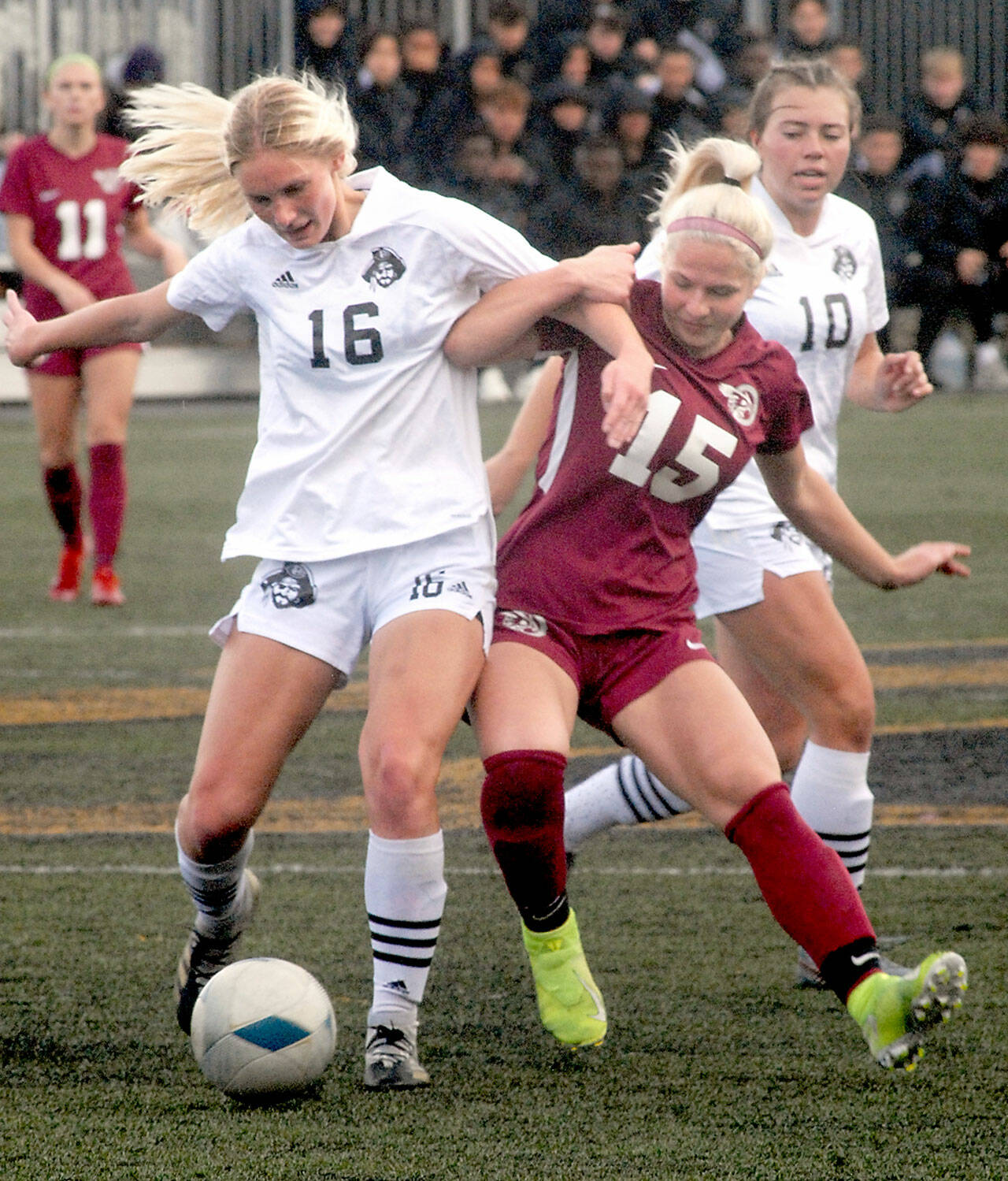 Peninsula’s Millie Long, front left, tangles with Pierce’s Rachel Mironchuk as Long’s teammate, Grace Johnson, looks on from behind during Saturday’s NWAC quarterfinal playoff match in Port Angeles. (Keith Thorpe/Peninsula Daily News)