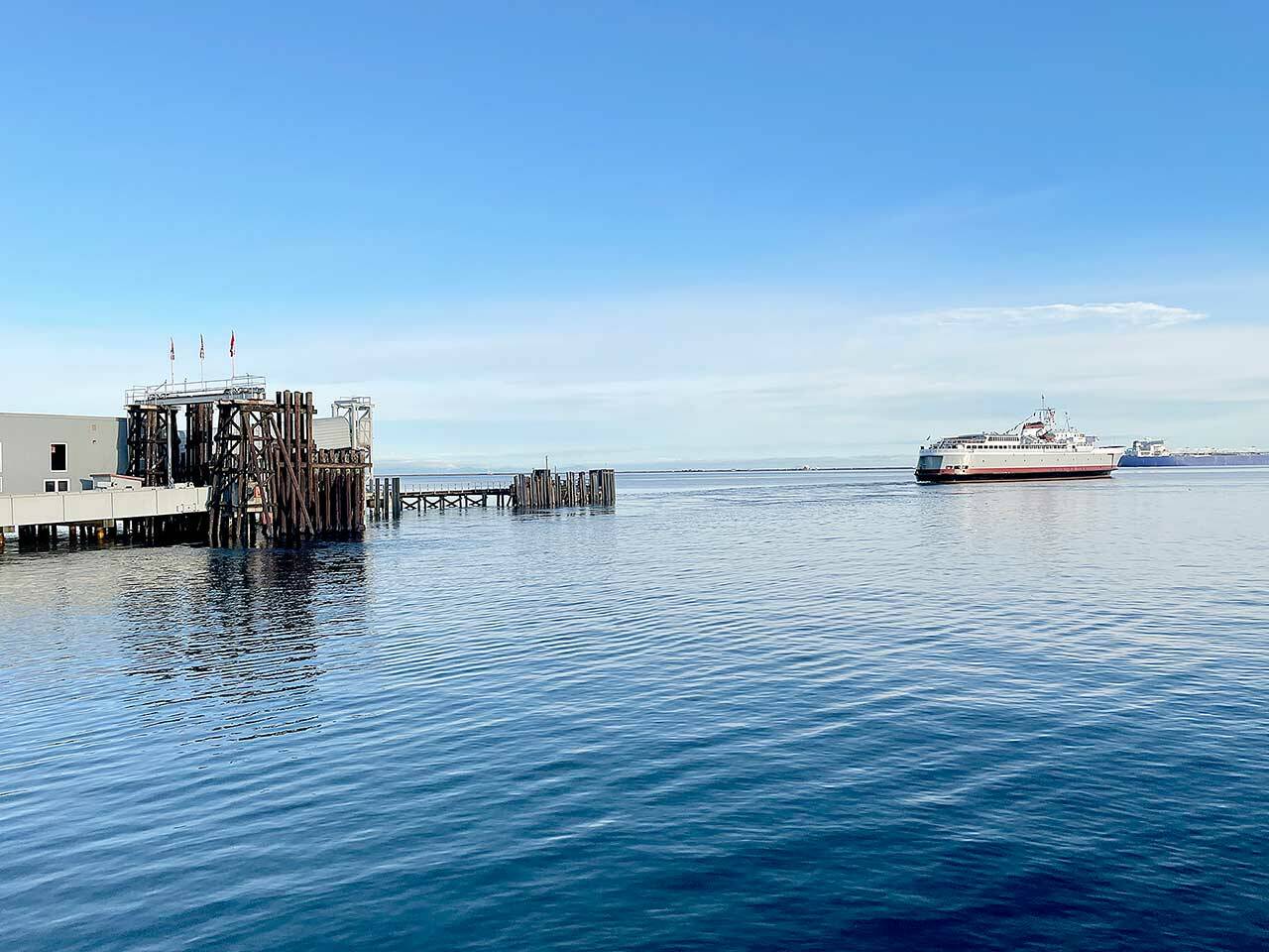 The M/V Coho leaves Port Angeles Harbor on Monday morning on its way to Victoria for the first time since March 2020. The COVID-19 pandemic shut down travel between the two countries as both land and sea borders had been closed. For more on the reopening, see Tuesday’s print editions. (Scott Gardinier/Peninsula Daily News)