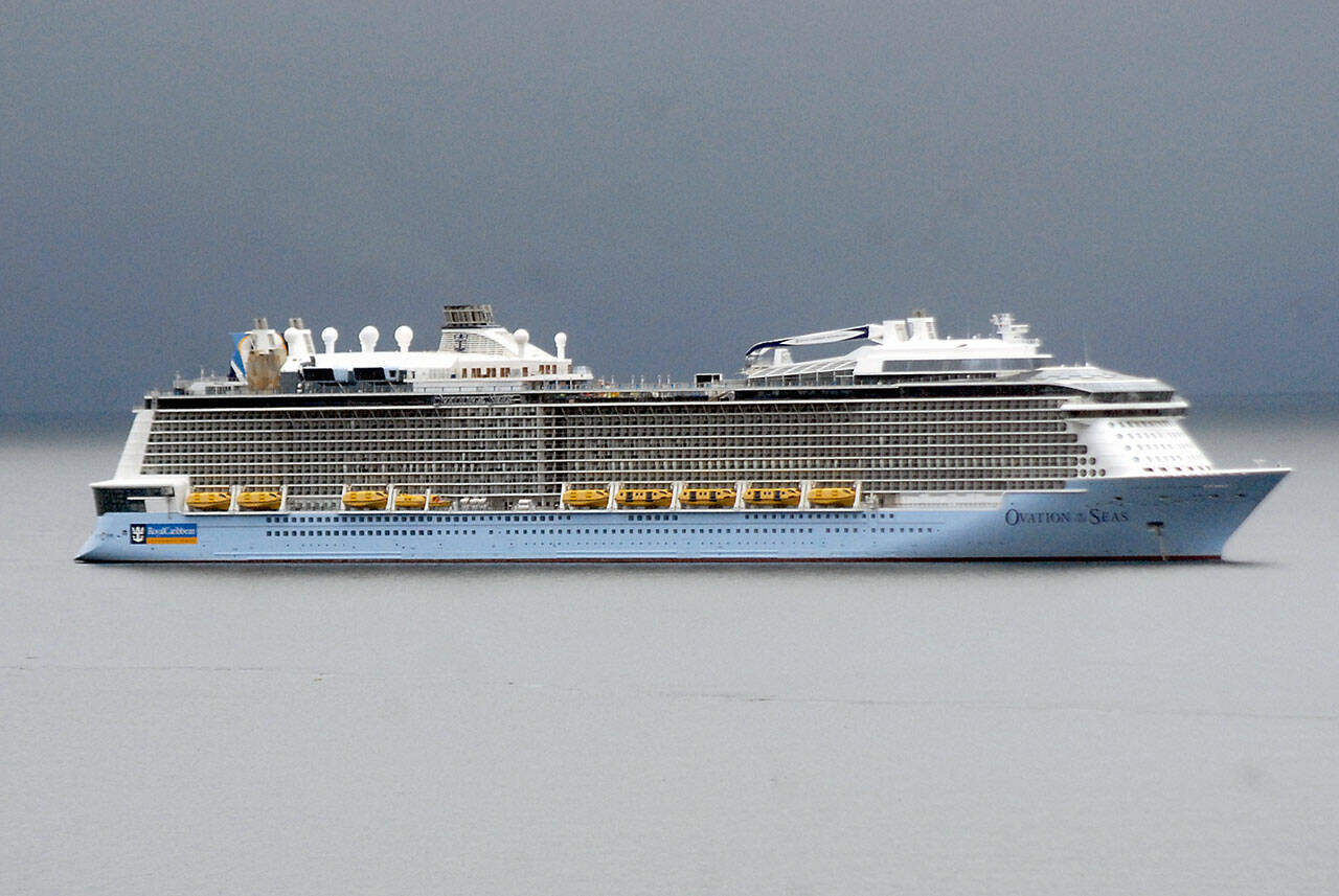 The Royal Caribbean Cruises ship Ovation of the Seas sits anchored at the mouth of Port Angeles Harbor on Tuesday. (Keith Thorpe/Peninsula Daily News)