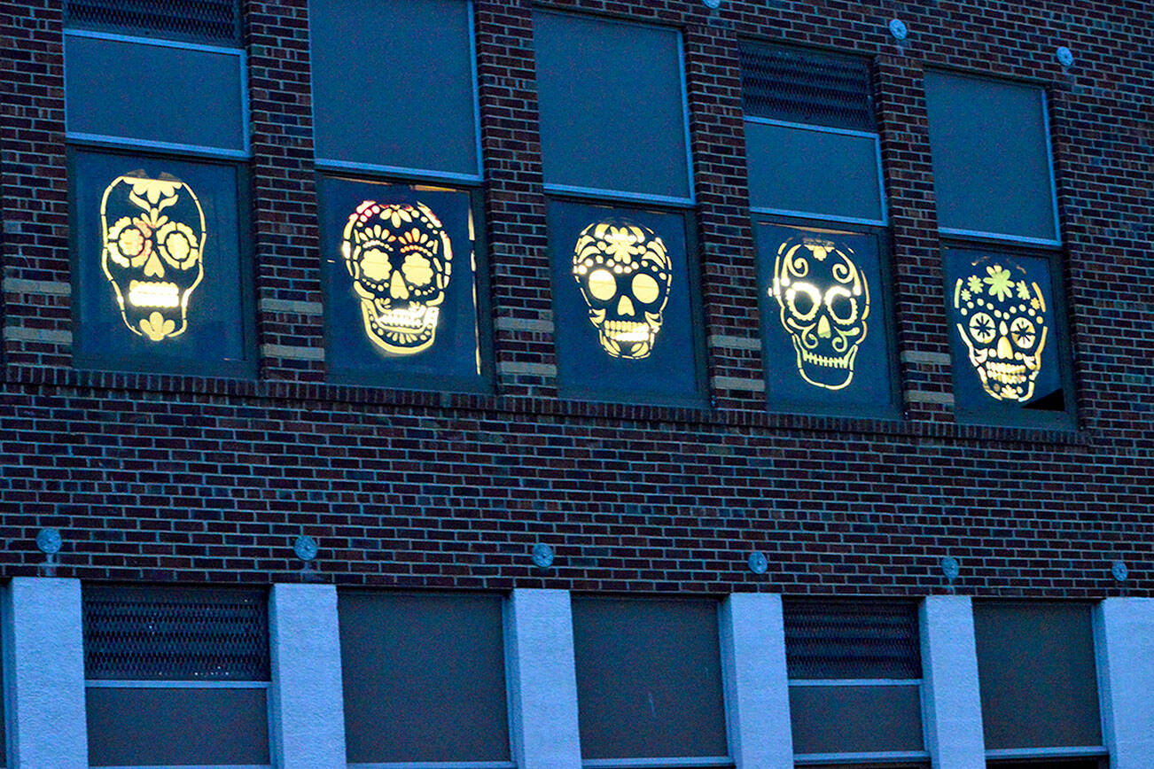 In honor of the Day of the Dead, Port Townsend High School students constructed decorations for the school's second-floor windows facing Benton Street. The students invite people to drive or walk past the windows as they're illuminated tonight and Monday night. Diane Urbani de la Paz/Peninsula Daily News