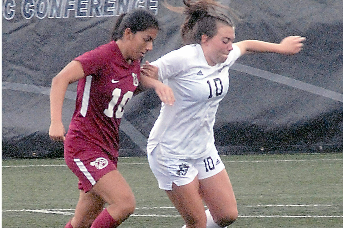 Keith Thorpe/Peninsula Daily News
Pierce's Regina Garay, left, and Peninsula's Grace Johnson chase a loose ball on Saturday in Port Angeles. Johnson was one of six Pirate women named to the NWAC's North Region All-Star Team this week. Johnson and Peninsula play Columbia Basin in the NWAC Semifinals today at Starfire Sports Complex in Tukwila.
