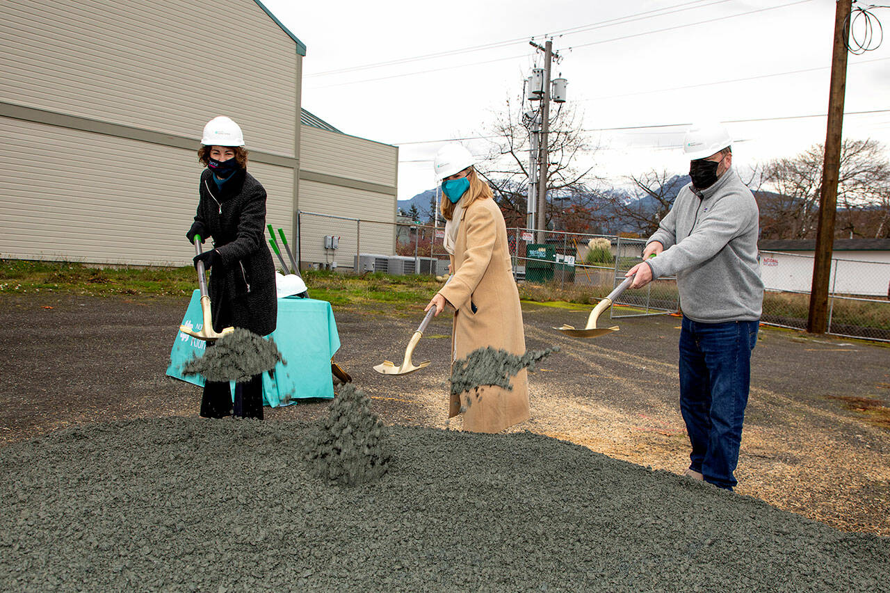 From left Dr. Suzanne Watnick, chief medical officer of Northwest Kidney Centers; Rebecca Fox, CEO of Northwest Kidney Centers; and state Rep. Mike Chapman, D-Port Angeles, break ground for the new Port Angeles Kidney Center on Chase Street.
