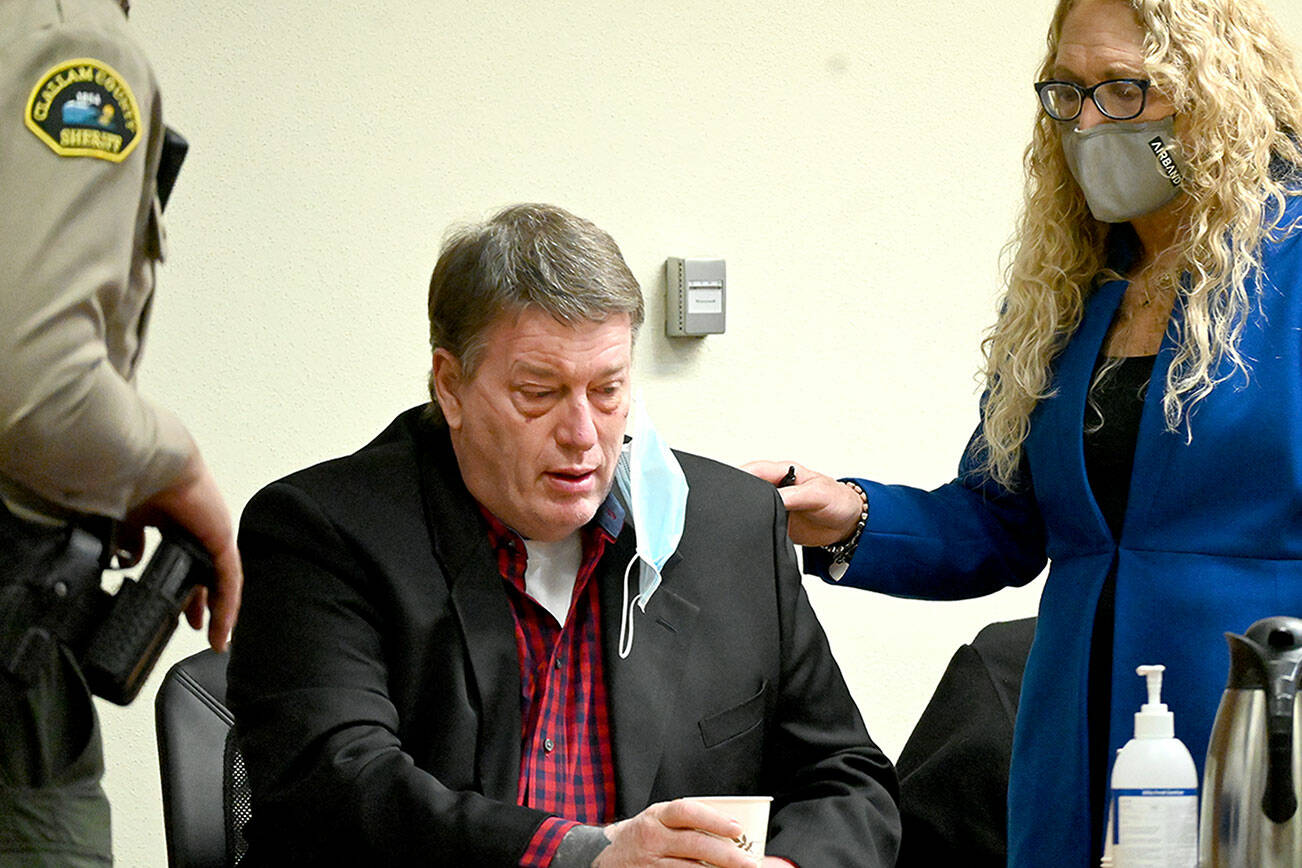 Paul Gottlieb/Peninsula Daily News
Accused triple-murderer Dennis Bauer reacts to the appearance of accused co-conspirator Ryan Ward in Clallam County Superior Court on Wednesday.