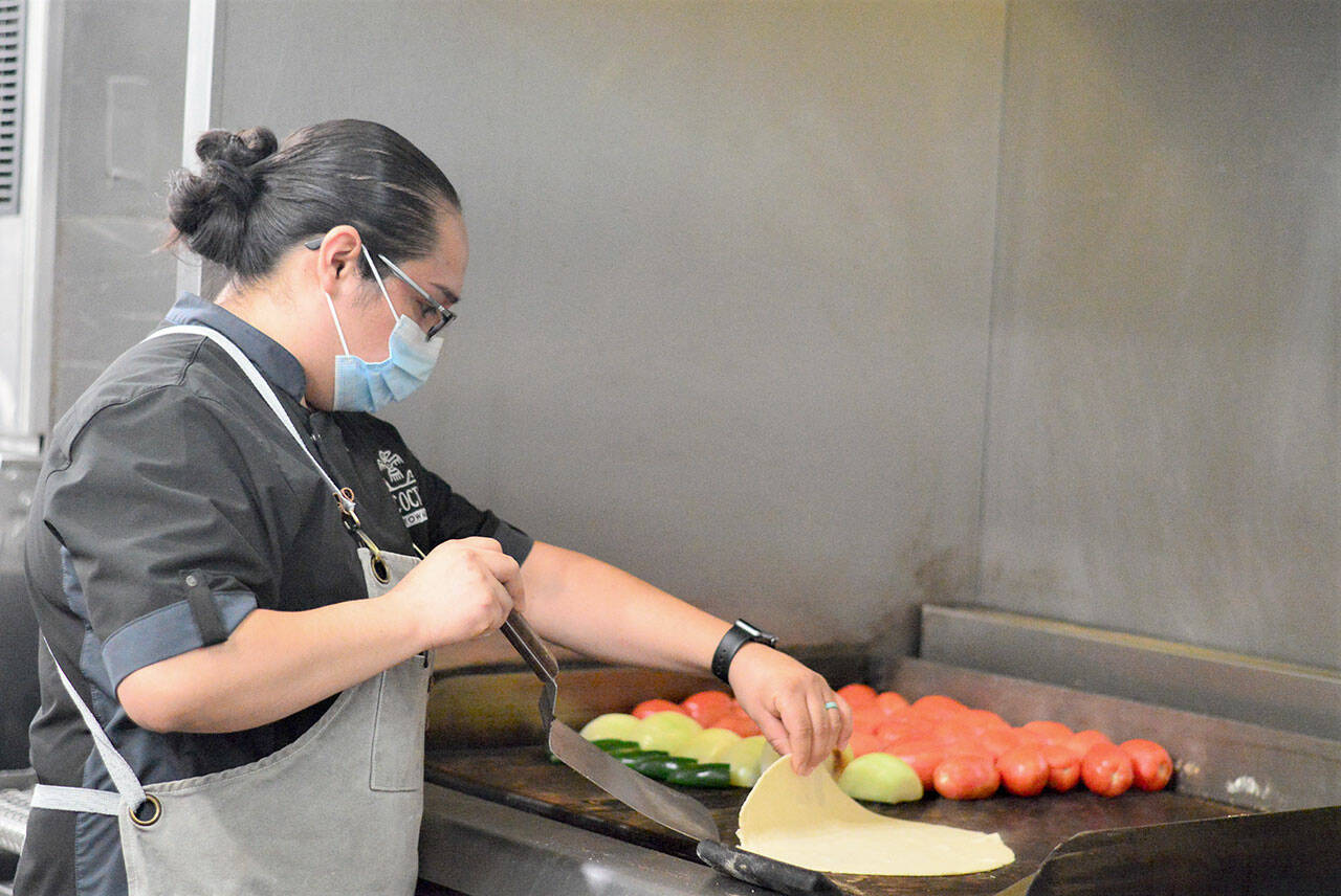 In her tiny La Cocina kitchen in Port Townsend, executive chef and owner Lissette Garay makes a variety of specialties from scratch, including fresh tortillas. (Diane Urbani de la Paz/Peninsula Daily News)