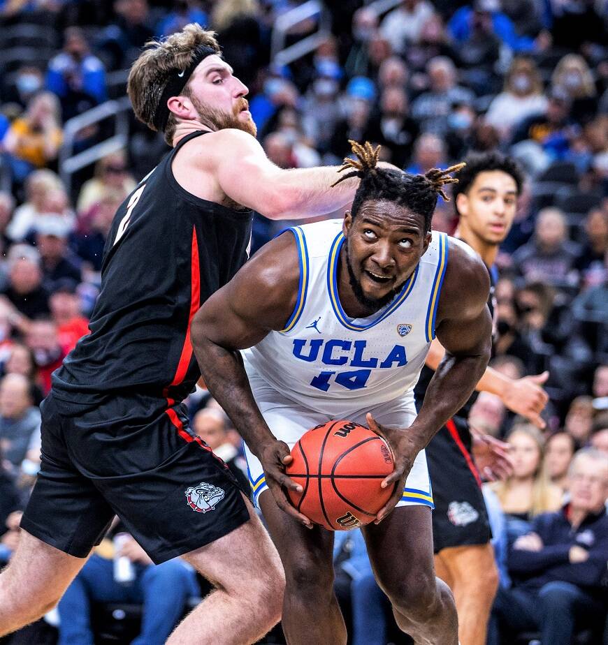 UCLA forward Kenneth Nwuba (14) looks to shoot while Gonzaga forward Drew Timme (2) defends during the first half Tuesday in Las Vegas. (AP Photo/L.E. Baskow)