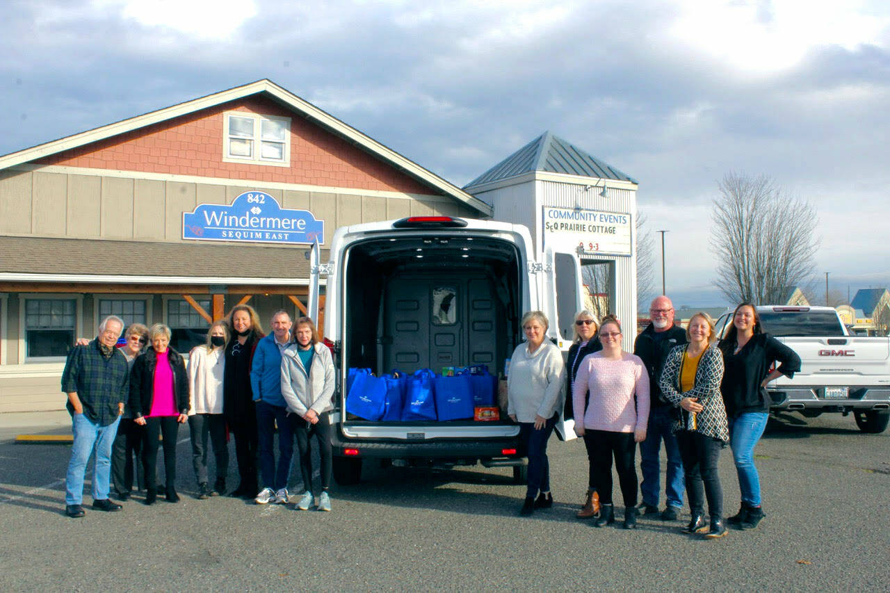 Pictured, from left, are Dave Sharman, Susan Barger, Svea Sparks, Dollie Sparks, Alan Burwell, Carol Dana, Andra Smith from the Sequim Food Bank and Jody McLean, Jessica Warriner, Rick Brown, Marcee Medgin and Tatiana Wild from Windermere.