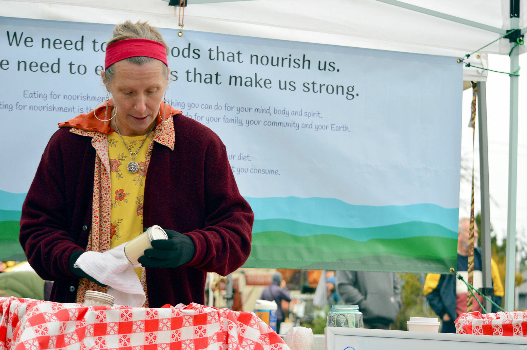 Sonya Zoha, who sells alternative milk beverages, is among some 40 vendors who will set up at the Port Townsend Farmers Market for just three more Saturdays. (Diane Urbani de la Paz/Peninsula Daily News)