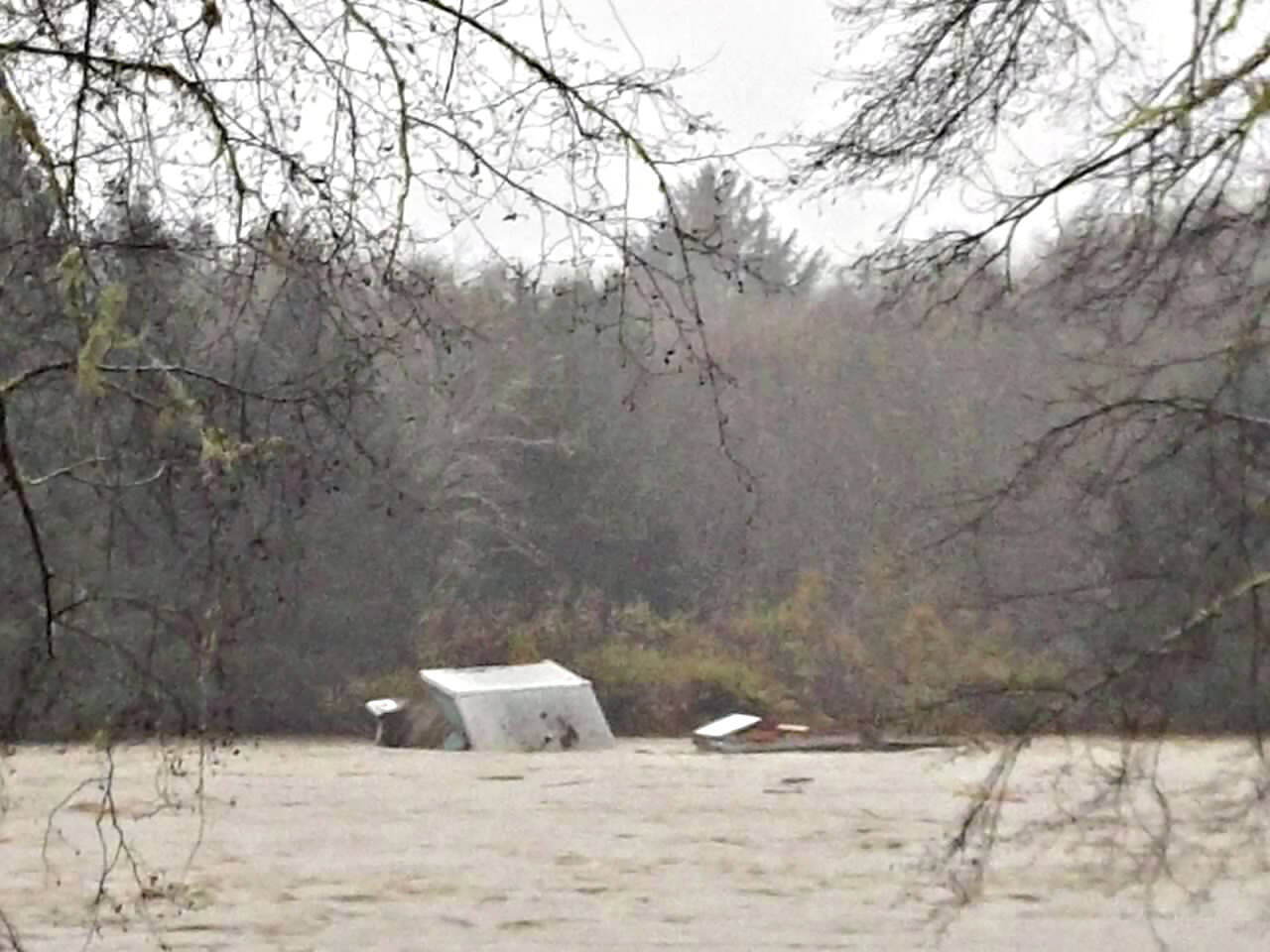 A cabin was seen floating down the Quillayute River and a snapshot taken by Richwine Road resident Lisa Kemmerer. (Photo courtesy Lisa Kemmerer)