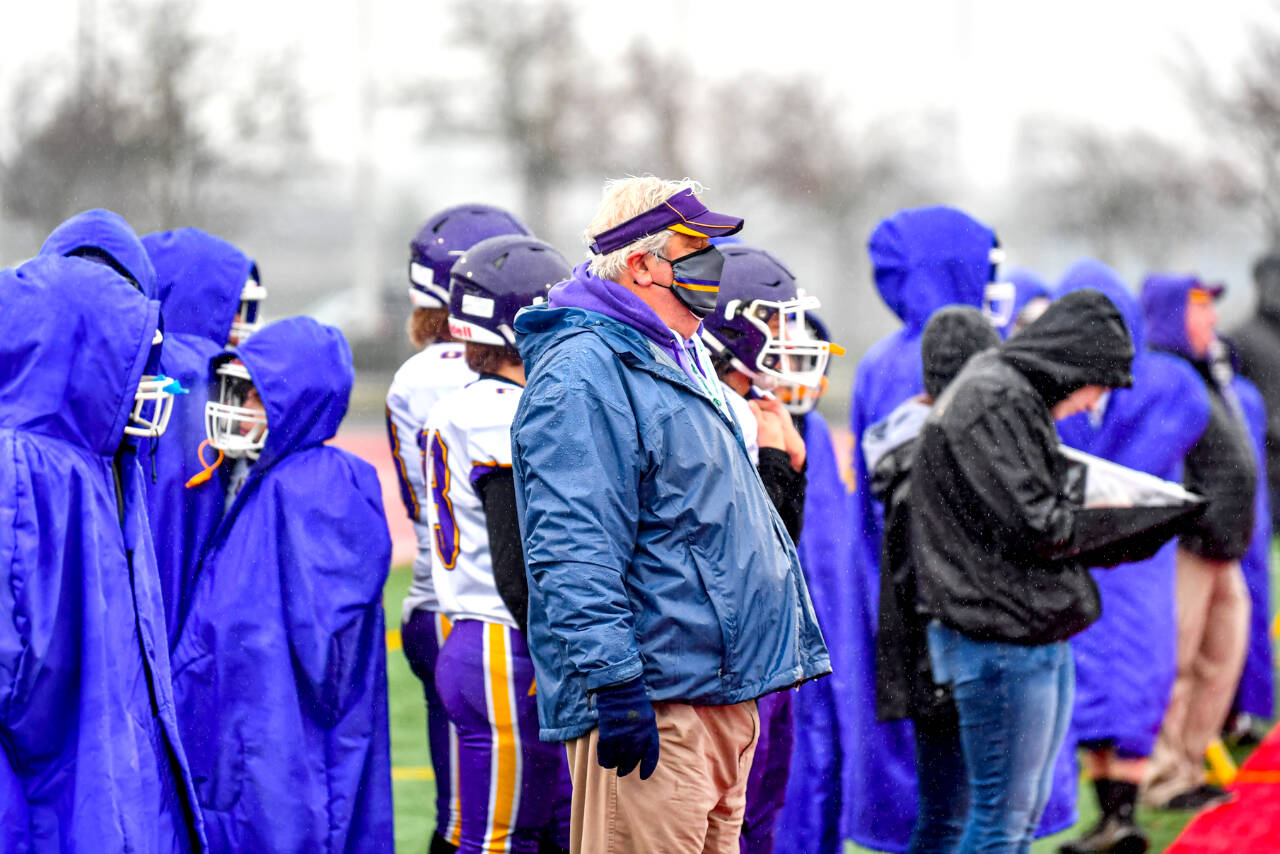 Jim Wilkerson/for Peninsula Daily News Quilcene coach Trey Beathard watches the 1B championship game from the sidelines during the first half.