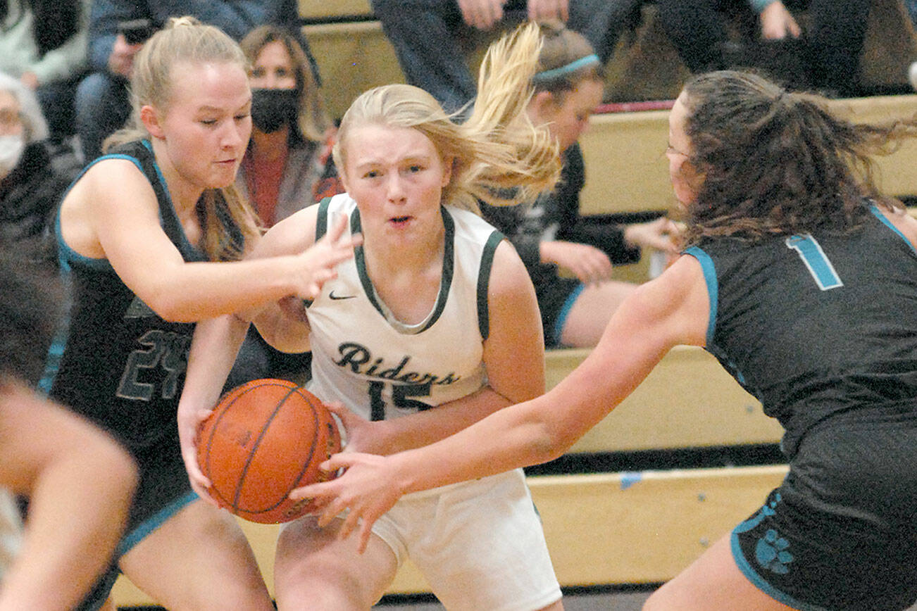 Keith Thorpe/Peninsula Daily news
Port Angeles' Paige Mason, center, tries to break through the Bonney Lake defense of Kaylie Hellner, left, and Ava Rice on Saturday in Port Angeles.
