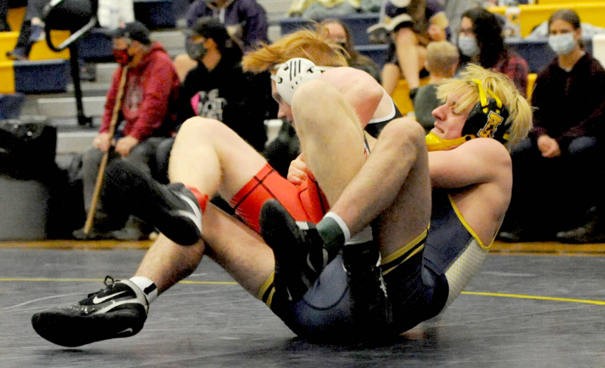 Forks' Jake Weakley, right, pinned East Jefferson's Gabe Evans in the 160-pound class during the Forks Wrestling Invitational held Saturday in the Spartan Gym. (Lonnie Archibald/for Peninsula Daily News)