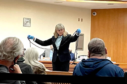 Clallam County Sheriff’s Detective Stacy Sampson displays a rope found in the master bedroom at 52 Bear Meadow Road during Dennis Marvin Bauer’s triple0murder trial in Clallam County Superior Court on Monday. (Rob Ollikainen/for Peninsula Daily News)