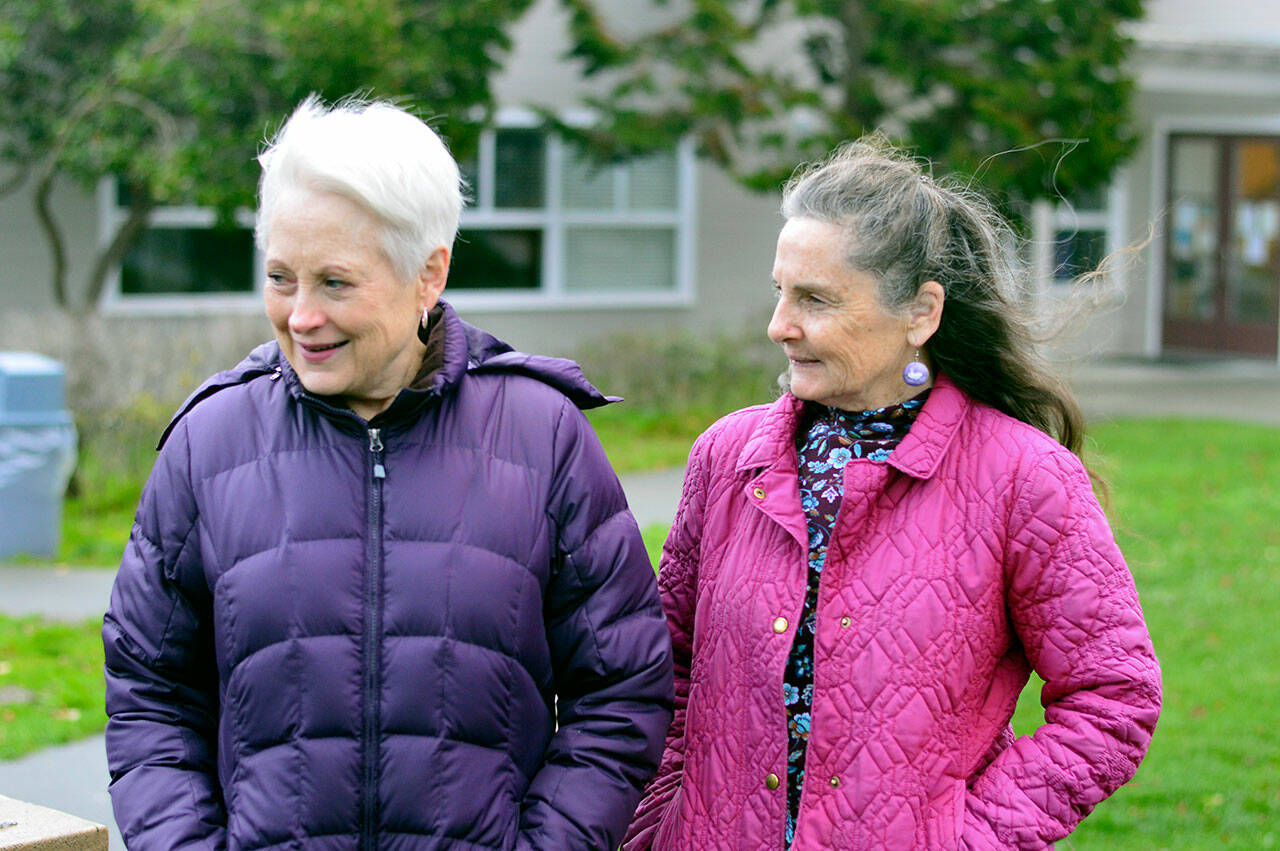 Marla Tangen, left, and Cyne Okinczyc, both of Port Townsend, are volunteers with the nonprofit Pet Helpers.  (Diane Urbani de la Paz / Peninsula Daily News)