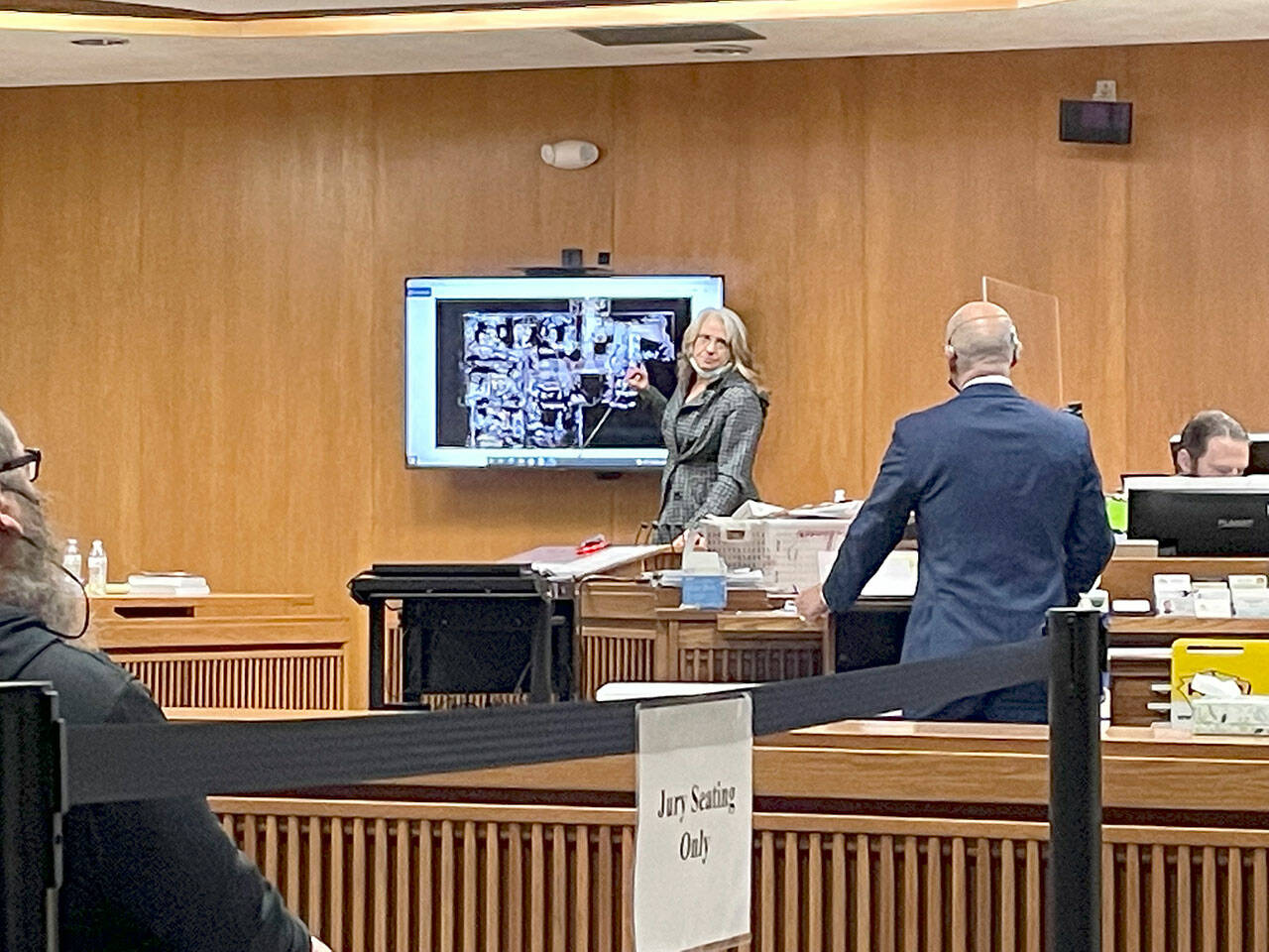 Noreen “Reenie” Iverson, ex-wife of Darrell Iverson and mother of Jordan Iverson, points to a layout of the home at 52 Bear Meadow Road during Dennis Marvin Bauer’s triple-murder trial in Clallam County Superior Court. (Rob Ollikainen/for Peninsula Daily News)