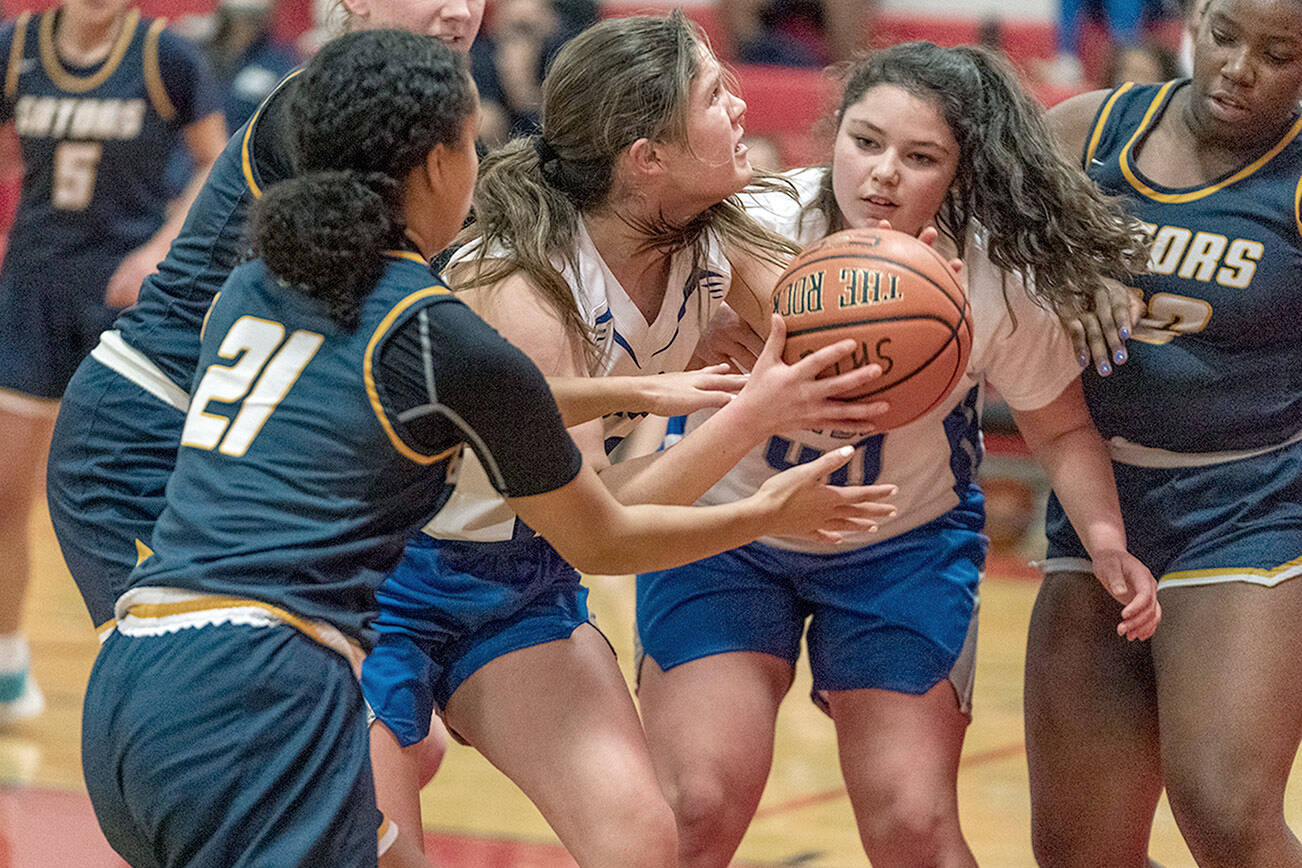 Steve Mullensky/for Peninsula Daily News
East Jefferson's Aurin Asbell, with ball, and Alyssa Vandenberg are blocked by Annie Wright's Jazmyn Stone 21 and Leah Kearns, 22, and Rae Wartell as she goes for the basket during a game Thursday at Port Townsend High School.