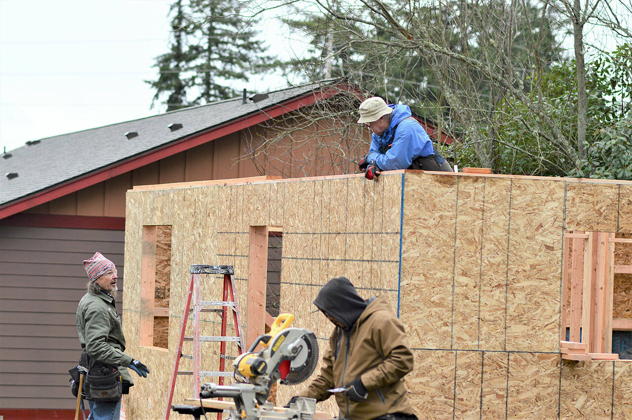 The crew building a two-bedroom Habitat for Humanity house across from Salish Coast Elementary School in Port Townsend includes workers from across the North Olympic Peninsula. From left, job site supervisor Dave Weld, Raul Torres and Dick Chambers. (Diane Urbani de la Paz/Peninsula Daily News)
